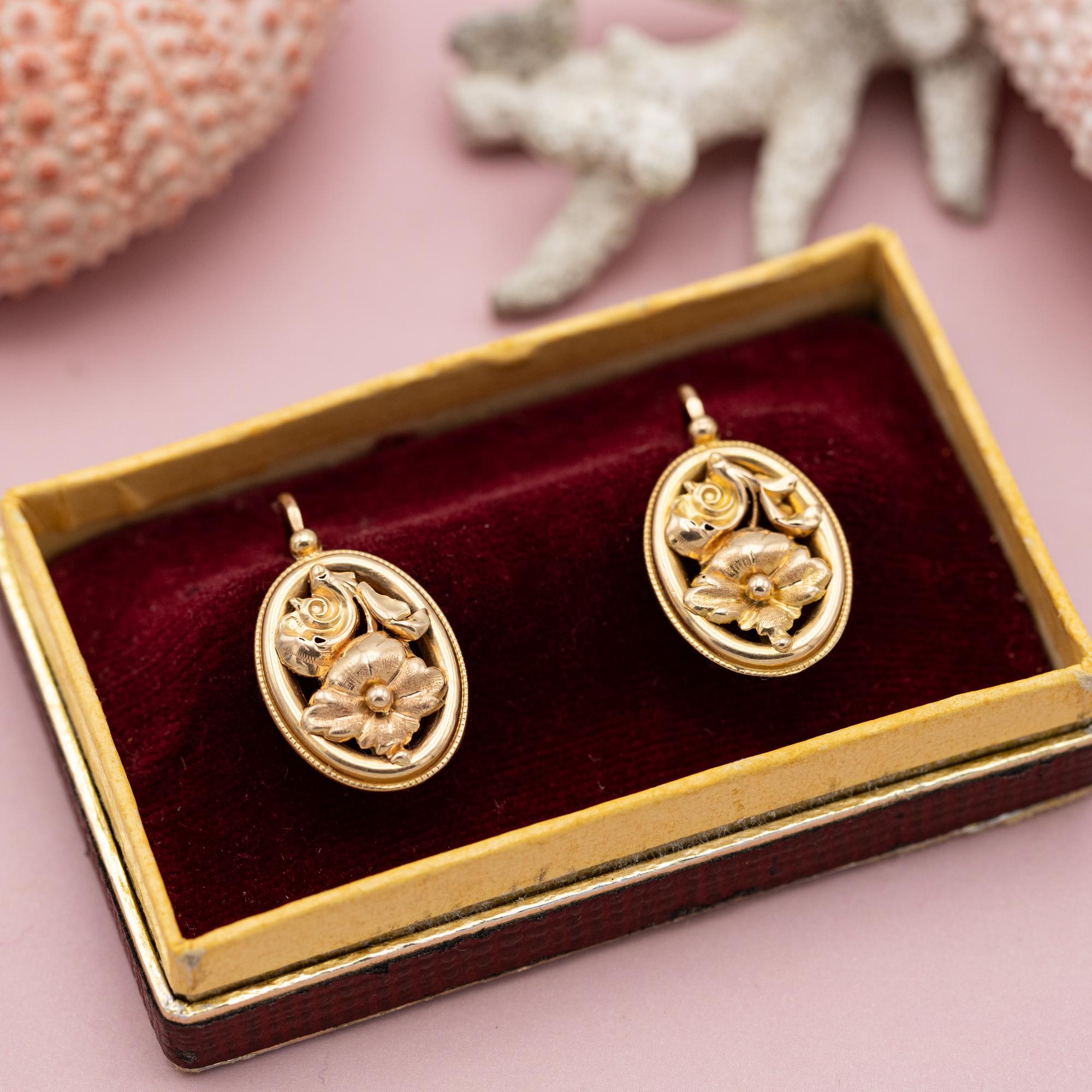 For sale are these romantic Napoleon III earrings. These 18 karat pinkish yellow gold dormeuse earrings (also called sleepers) have a front closure and are decorated with flower shaped ornaments and are finished with a lot of detail. The fine