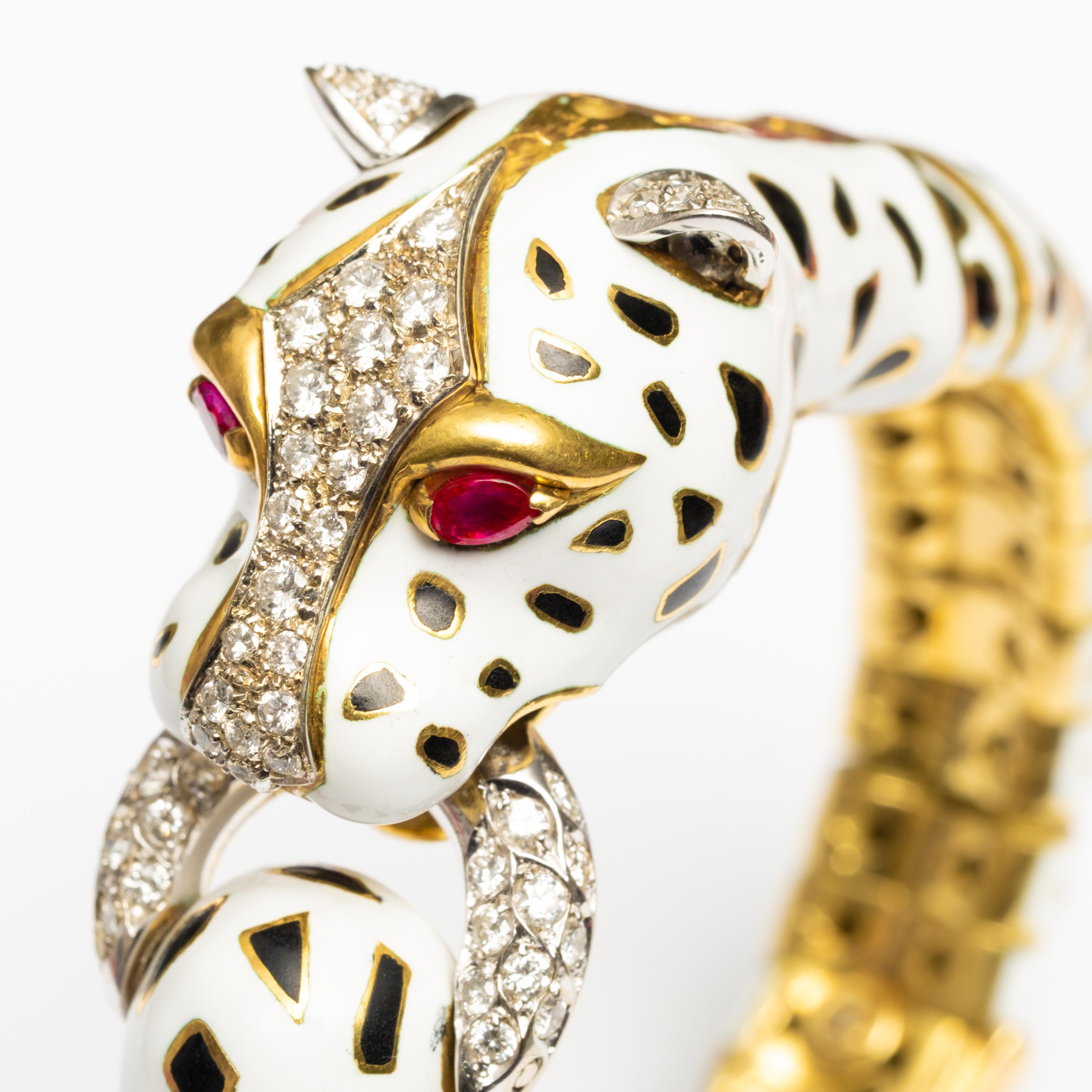 18K Frascarolo Modele Depose Enamel, Diamond and Ruby Bracelet. This Leopard shaped bracelet is set with round brilliant cut diamonds, pear shaped rubies and white and black enamel. It measures 7.25