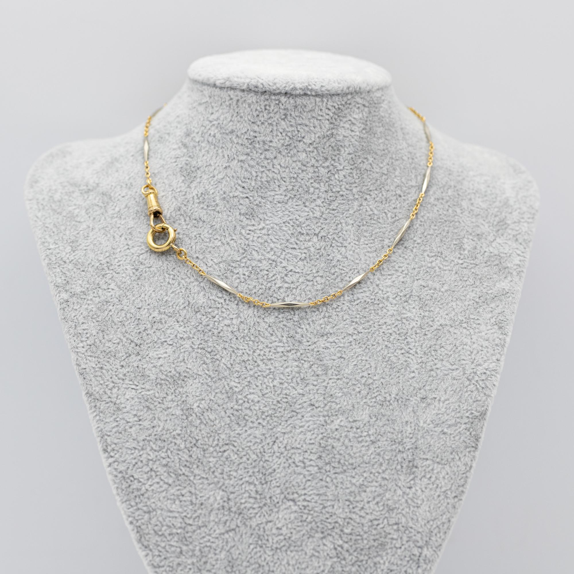 For sale is this wonderful two toned 18 K gold Albert necklace. It consists of thin fancy looking white gold Lozenge links, yellow gold chains, an antique dog clip and a lovely bolt ring. The necklace is fully hallmarked with French Eagle heads and