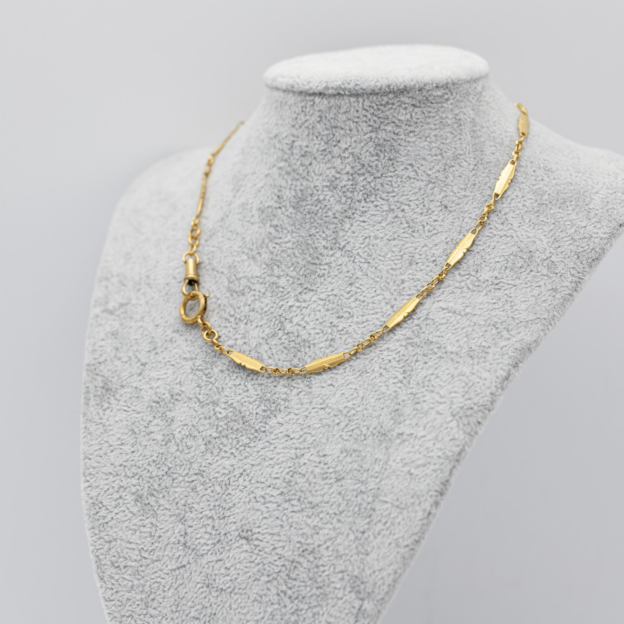 For sale is this wonderful 18 K yellow gold Albert necklace. It consists of spacial, fancy looking Lozenge links an antique dog clip and a lovely bolt ring. The necklace is hallmarked with French Eagle heads and a Rhino head. Both closures function