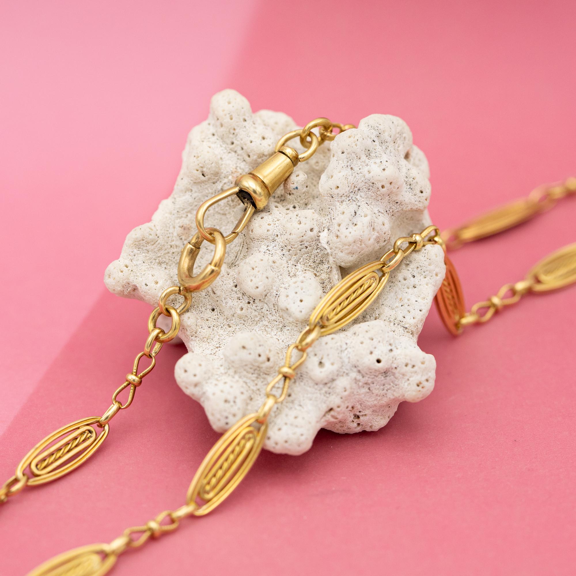 For sale is this wonderful 18 K yellow gold Albert necklace. It consists of spacial, fancy looking Lozenge links an antique dog clip and a lovely bolt ring. The necklace is hallmarked with French Eagle heads and a Rhino head. Both closures function