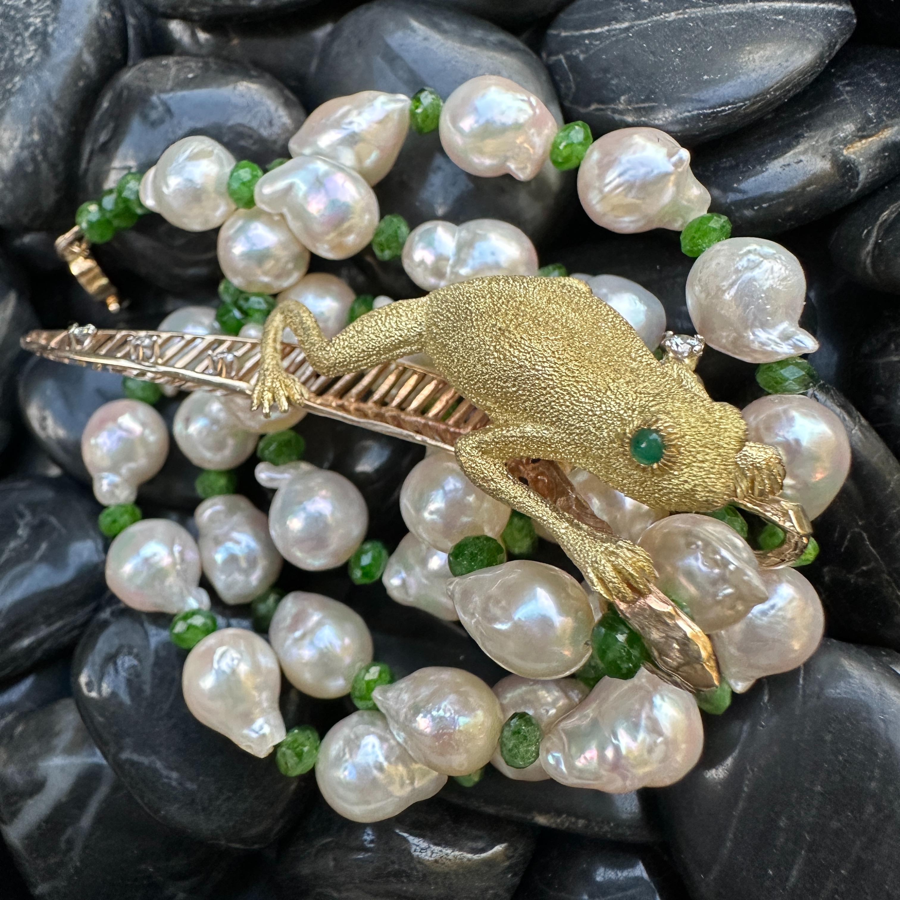 Here's something you're not going to see on every other gal in town!  This necklace is composed of repurposed and new elements and it's truly one-of-a-kind.

The frog with his rando elbow blingo was a brooch, and our research indicates he's a