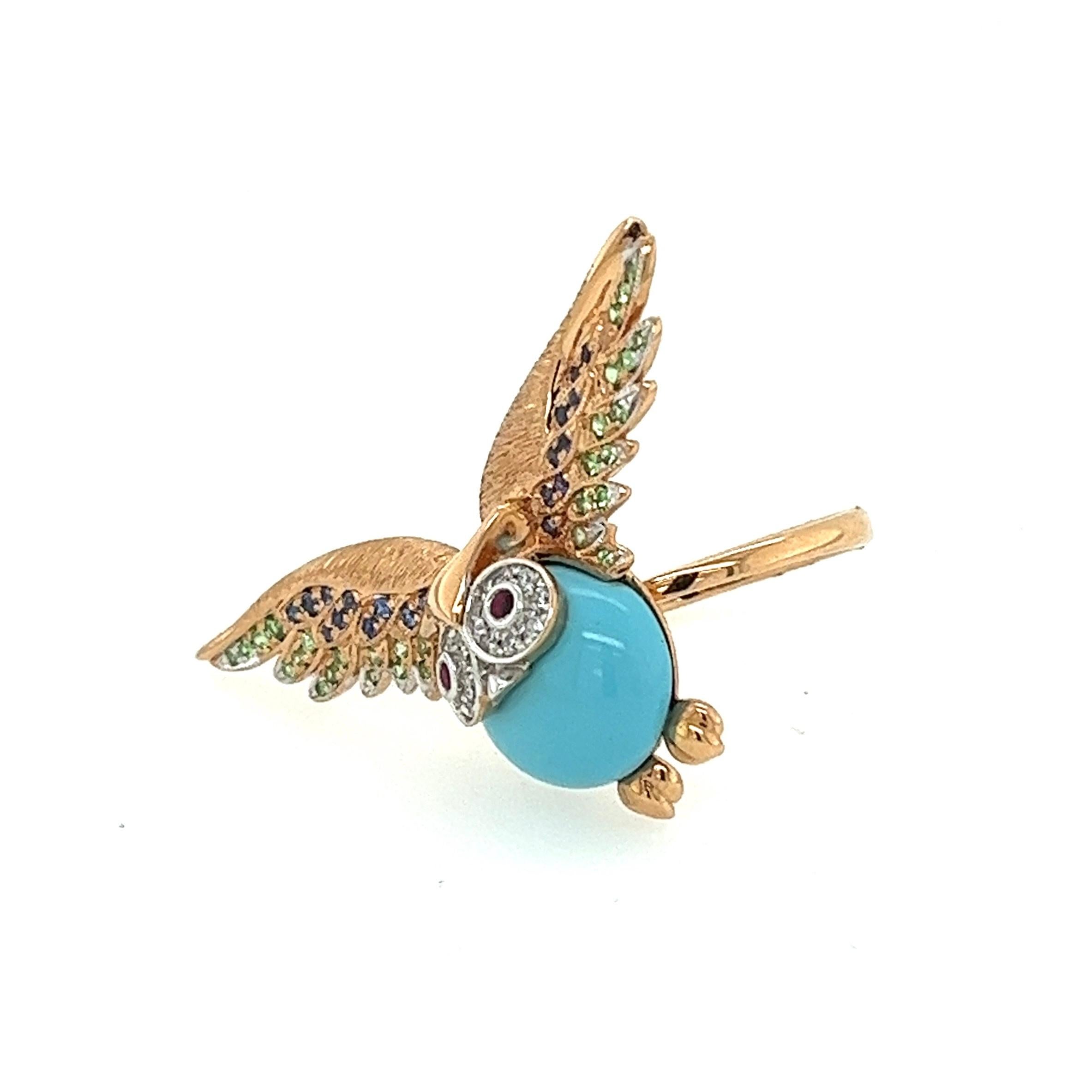 18K Gemstone Owl Turquoise Ring with Sapphires & Rubies

21 Blue Sapphires - 0.10 CT
14 Diamonds - 0.06 CT
33 Green Garnets - 0.14 CT
2 Rubies - 0.03 CT
1 Turquoise - 3.50 CT

Introducing a mesmerizing 18K Gemstone Owl Turquoise Ring adorned with