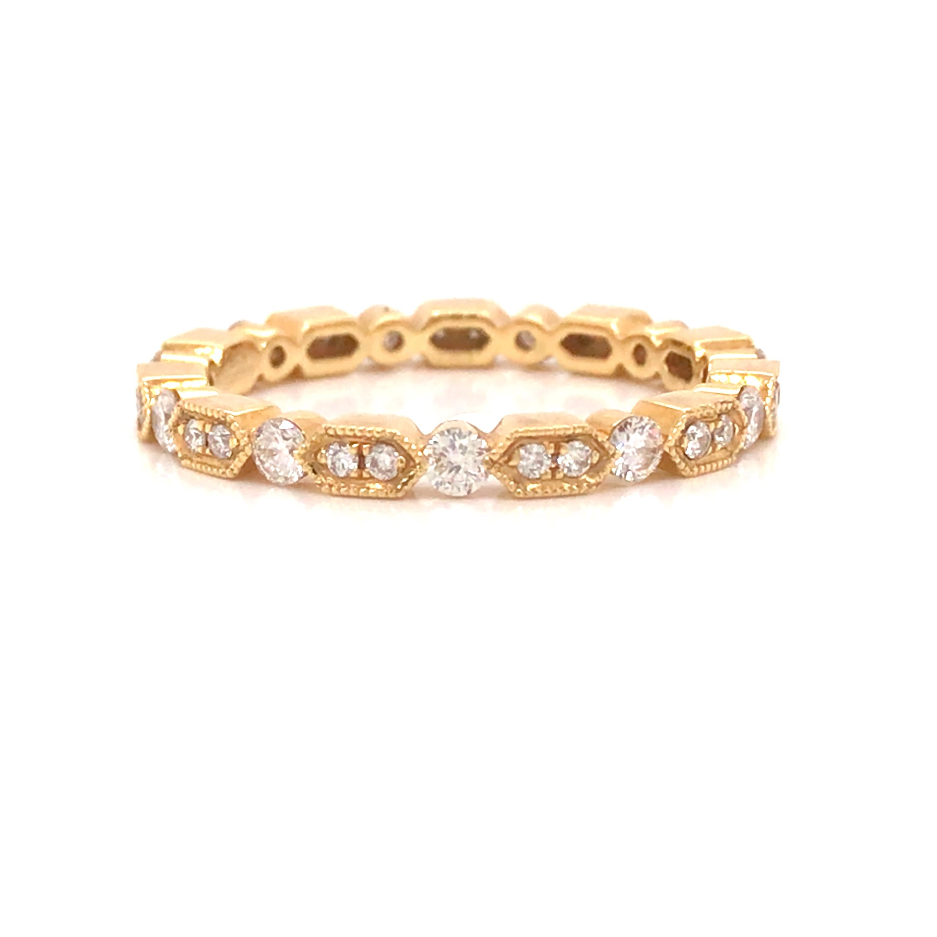 Diamond Miligrain Band in 18K Yellow Gold.  Round Brilliant Cut Diamonds weighing 0.56 carat total weight, G-H in color and VS-SI in clarity are expertly set.  The Ring measures 1/8 inch in width.  Ring size 6 1/2. 2.02 grams.