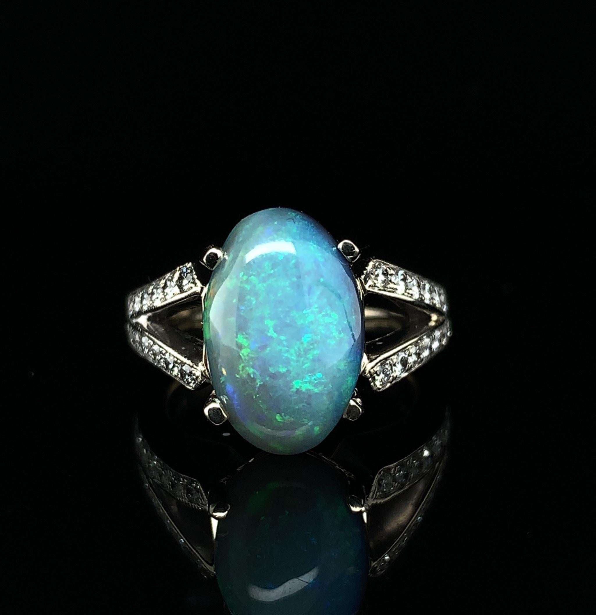 Contemporary 18k GIA 4.39ct Black Opal and Diamond Ring For Sale