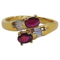 18K Gold 0.70ct Oval Red Ruby & 0.17ct Diamond Bypass Ring