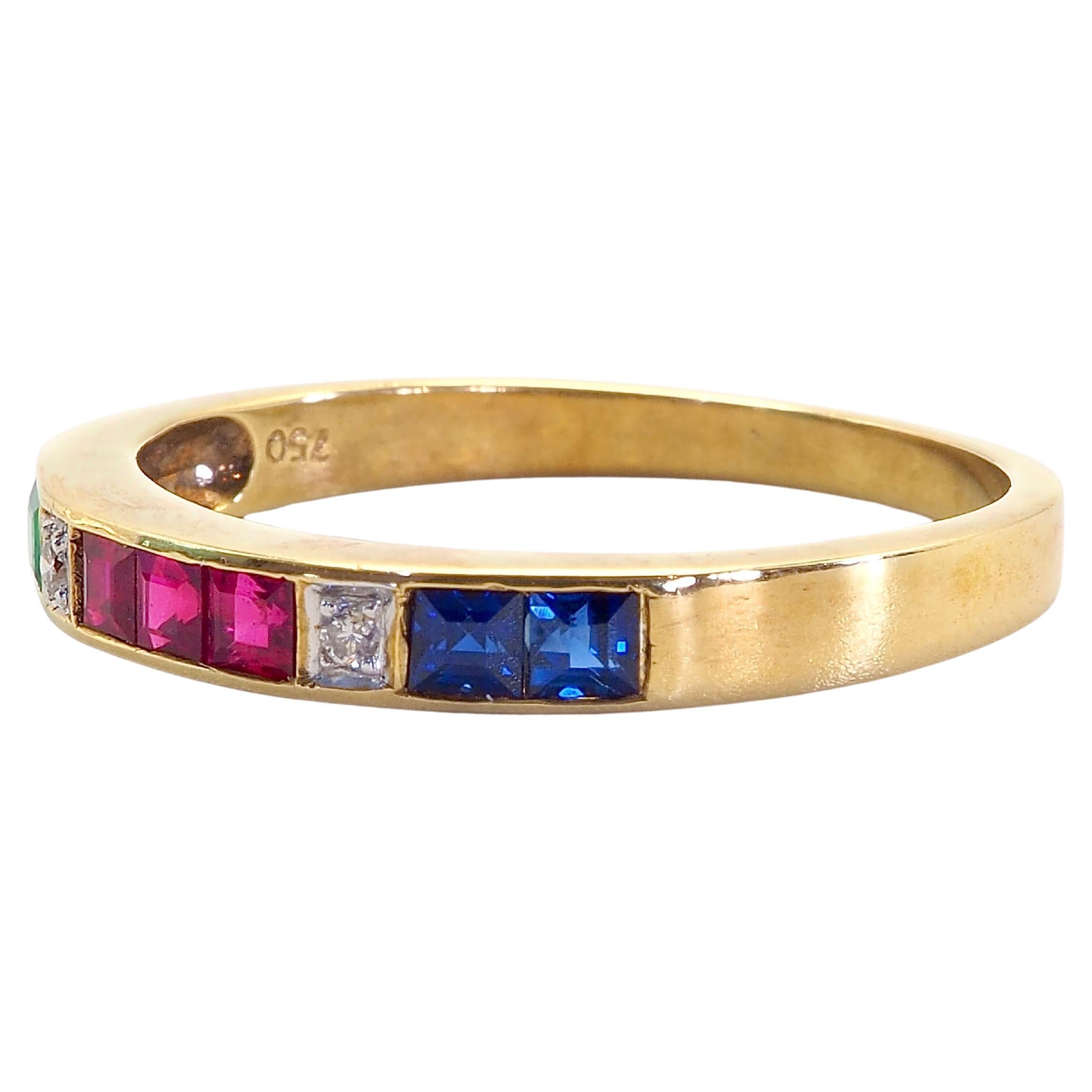 A gorgeous luxury Neo-vintage band ring that is both suitable for all sexes. This ring has beautiful highly saturated colors of 2 squared green emerald, 2 squared blue sapphires and 3 squared vivid red rubies, plus 2 diamonds are channeled nicely
