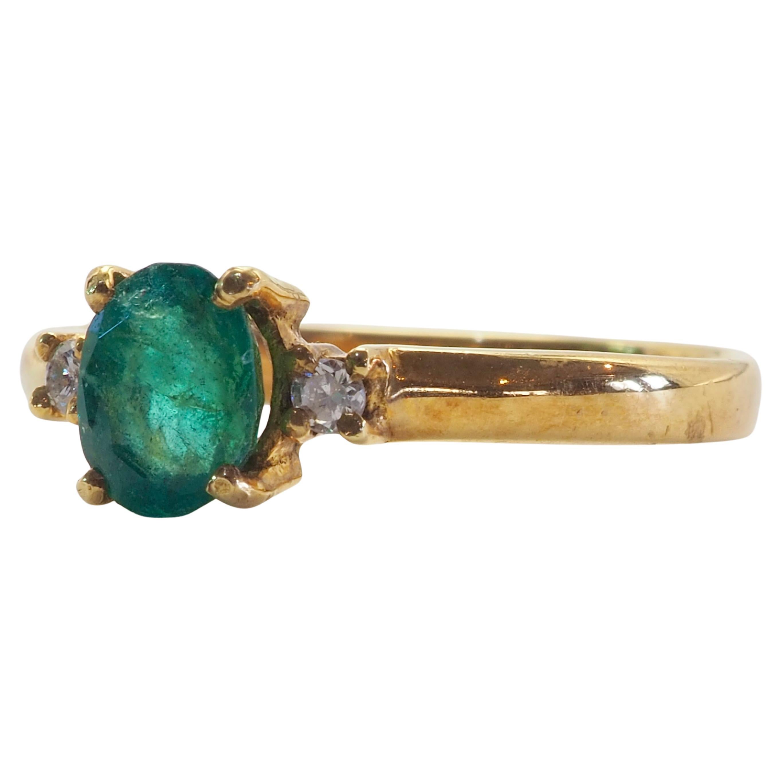 Classic and timeless design ring equipped with green oval emerald with natural inclusions and 2 brilliantly decent grade diamonds. For those who have a soft spot for pretty emeralds and for unassuming easy luxury wear.

Old stock at clearance