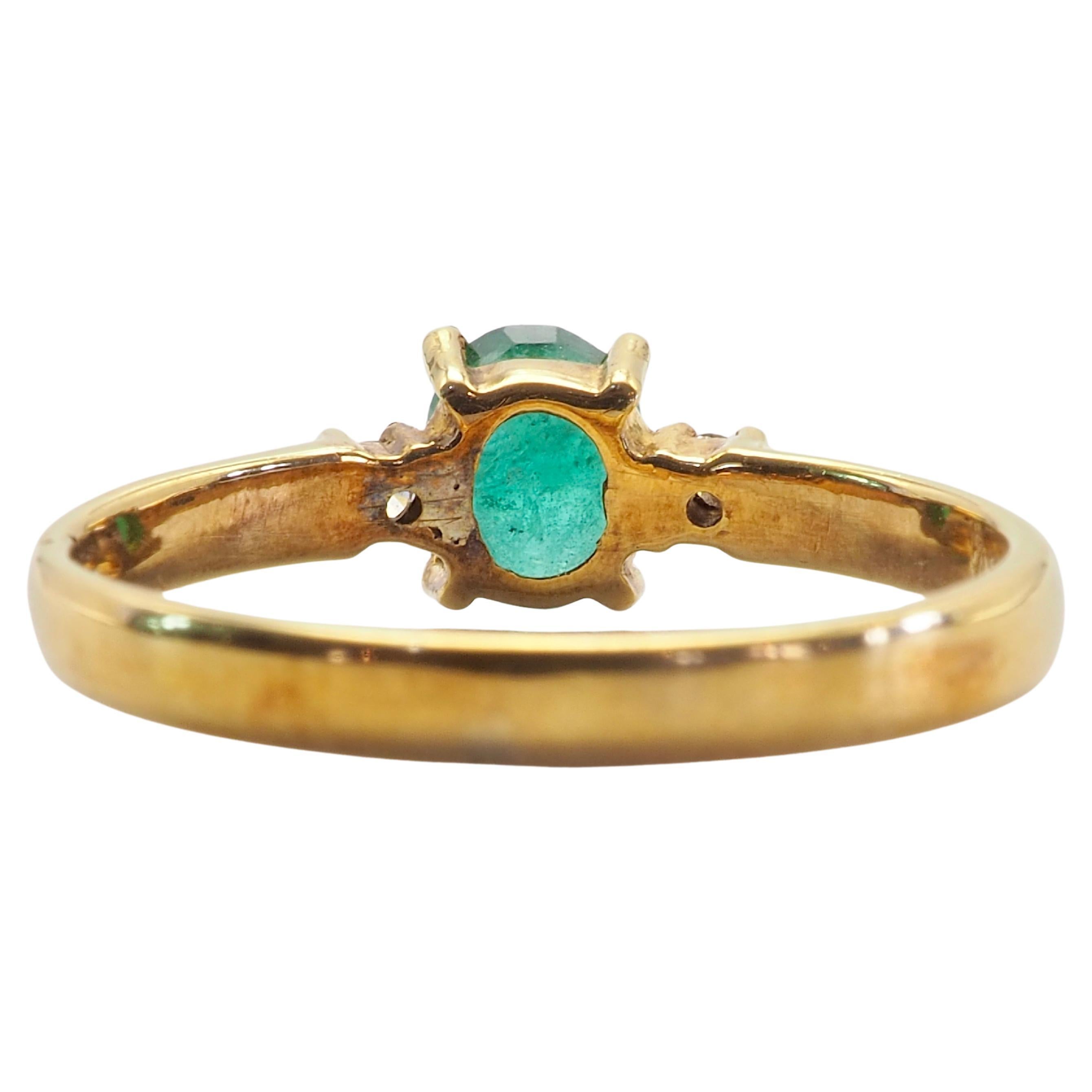 Oval Cut 18K Gold 0.62ct Oval Emerald & 0.06ct Brilliant Diamond Ring For Sale