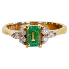 18K Gold 0.70ct Emerald Cut Tsavorite Garnet & 0.15ct Diamond Engagement Ring