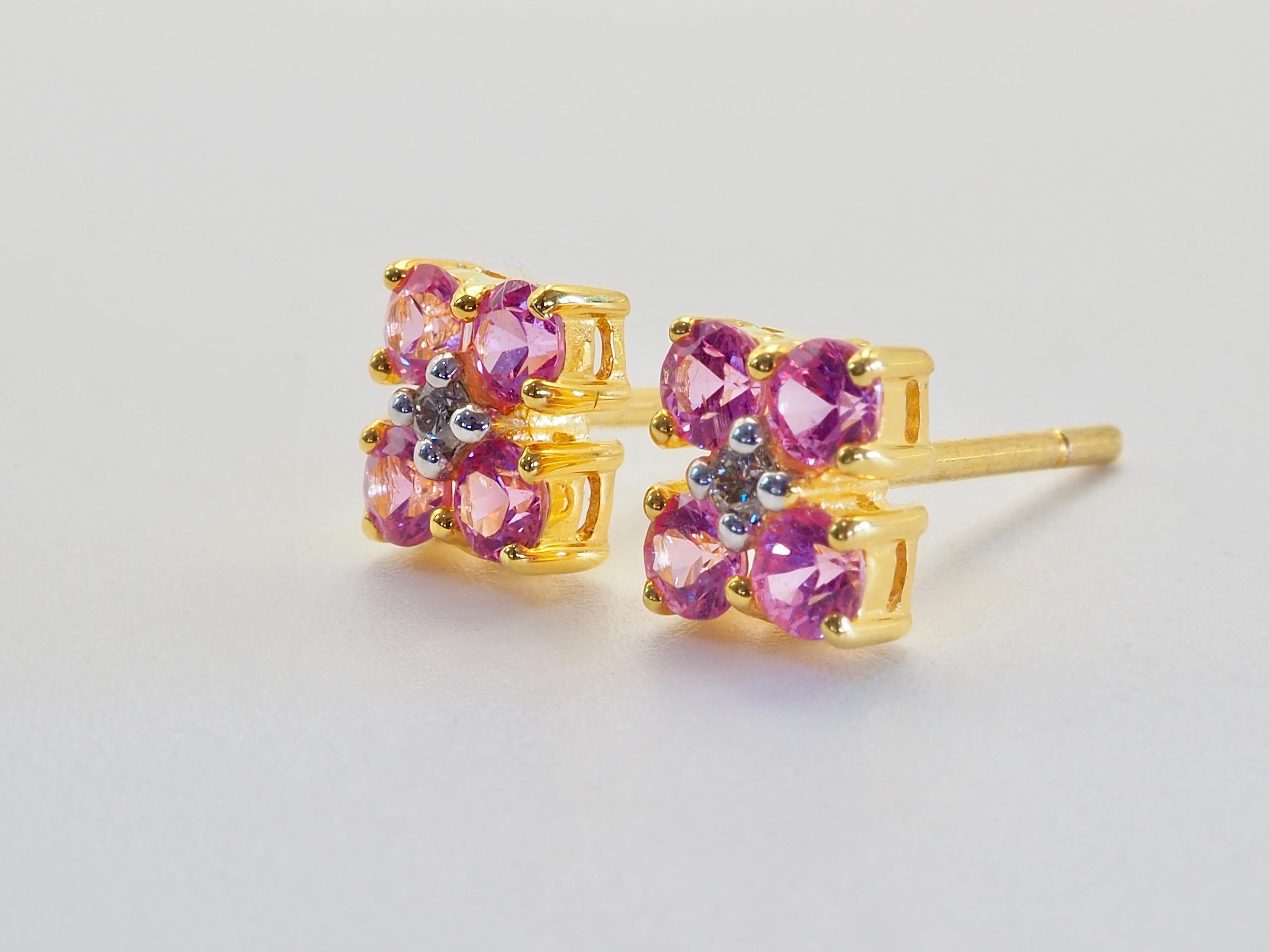 Beautiful and unique geometric earrings. The earrings have the unique geometric shape with prong setting design. There are 8 round and colorfully saturated pink sapphires in total and therefore 4 for each ear. They are immaculately set. The