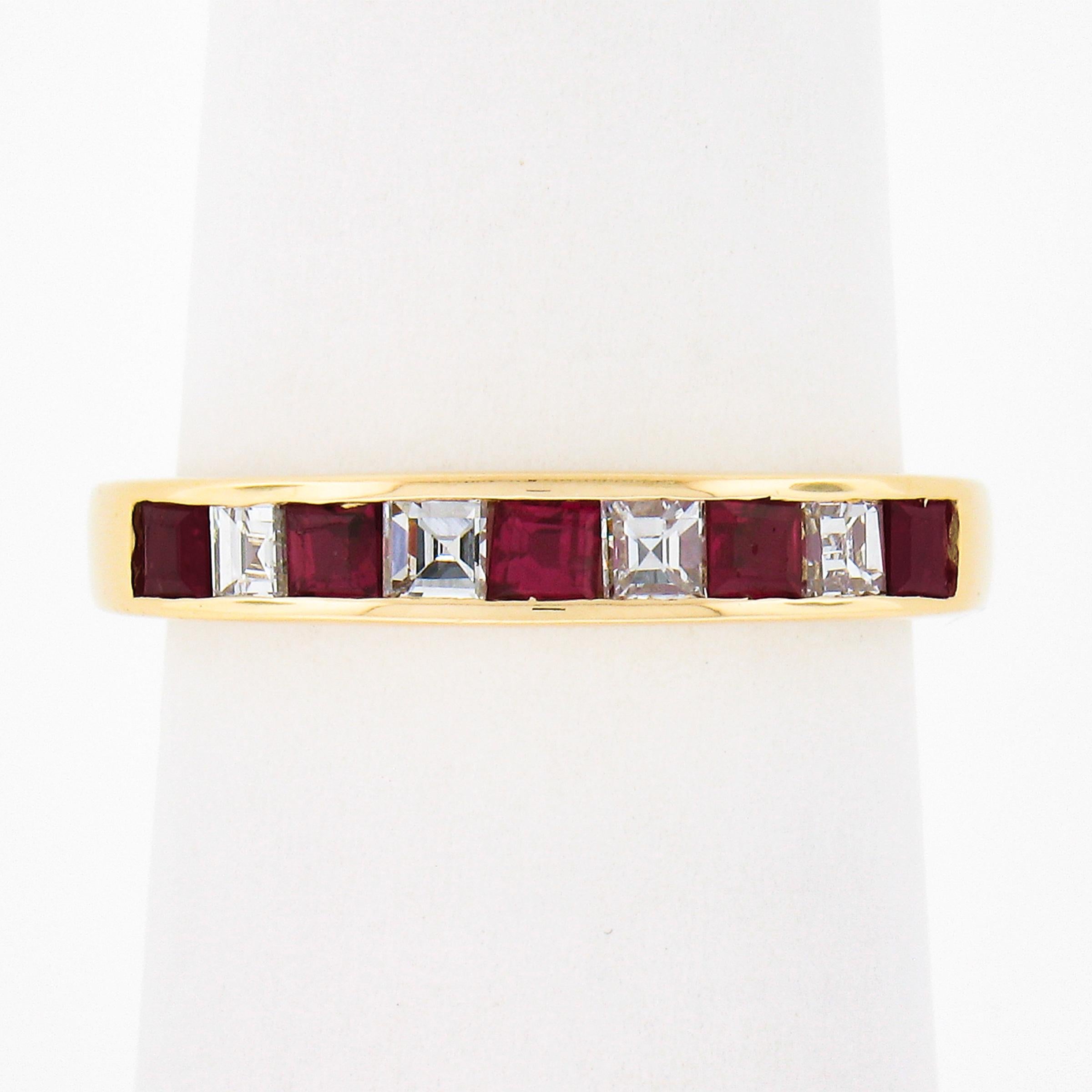 This stunning, HIGH QUALITY, ruby and diamond band ring is crafted in solid 18k yellow gold and elegantly carries the stones in an alternating pattern across its top in secure channel settings. The 5 ruby gemstones are square step cut and are very