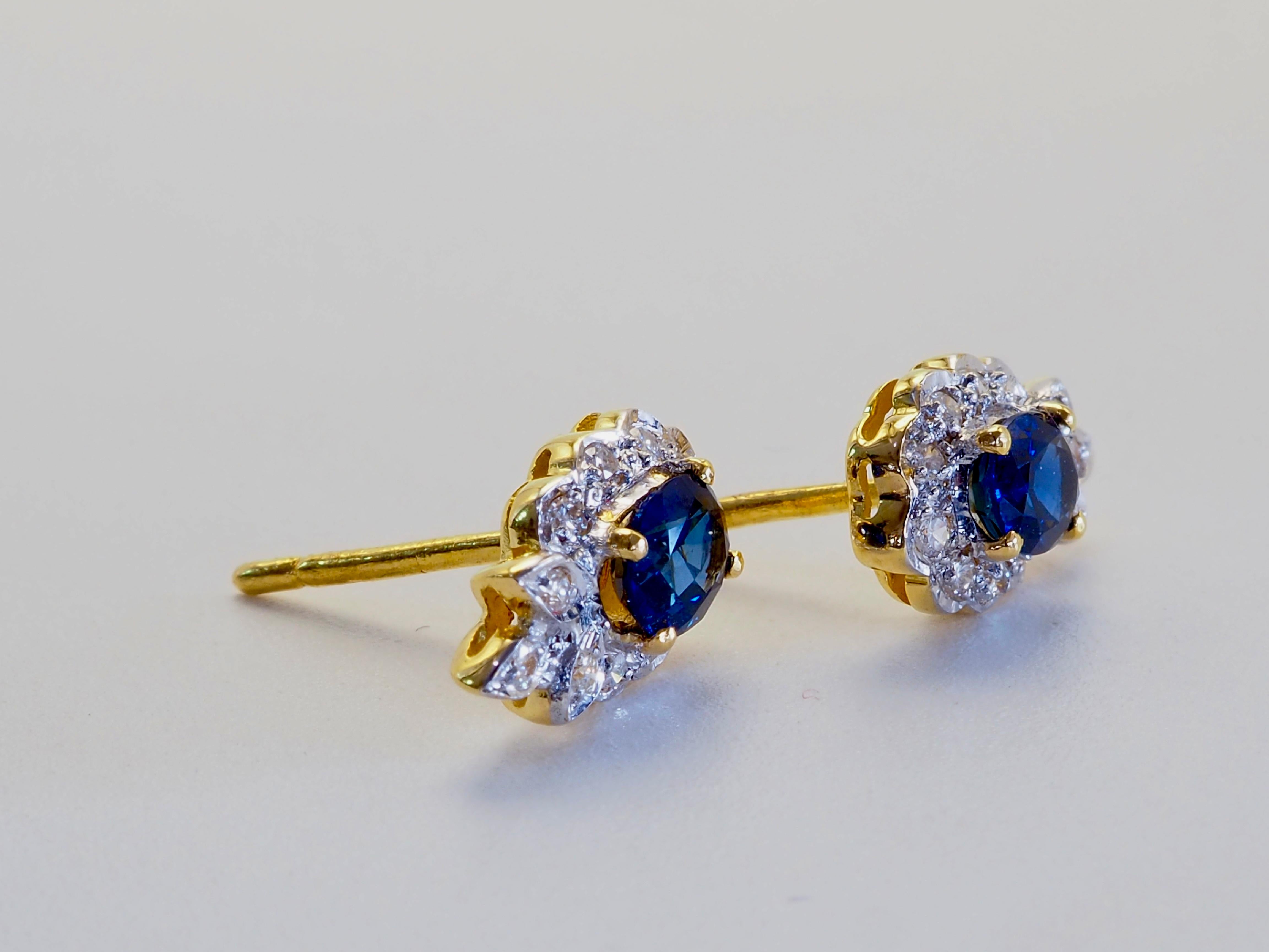 Fine quality stud earrings with fine quality blue sapphires and diamonds. Decorated and designed to assimilate the floral nature by intensive smithing rarely seen these days.

Product Details:

Metal: 18k Solid Gold
Metal Color: Yellow