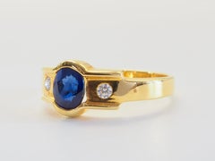 18K Gold 0.90ct Oval Blue Sapphire & 0.08ct brilliant Diamond Band Ring