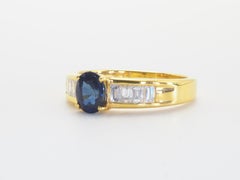 18k Gold 0.90ct Oval Blue Sapphire & 0.50ct Baguette Diamond Engagement Ring
