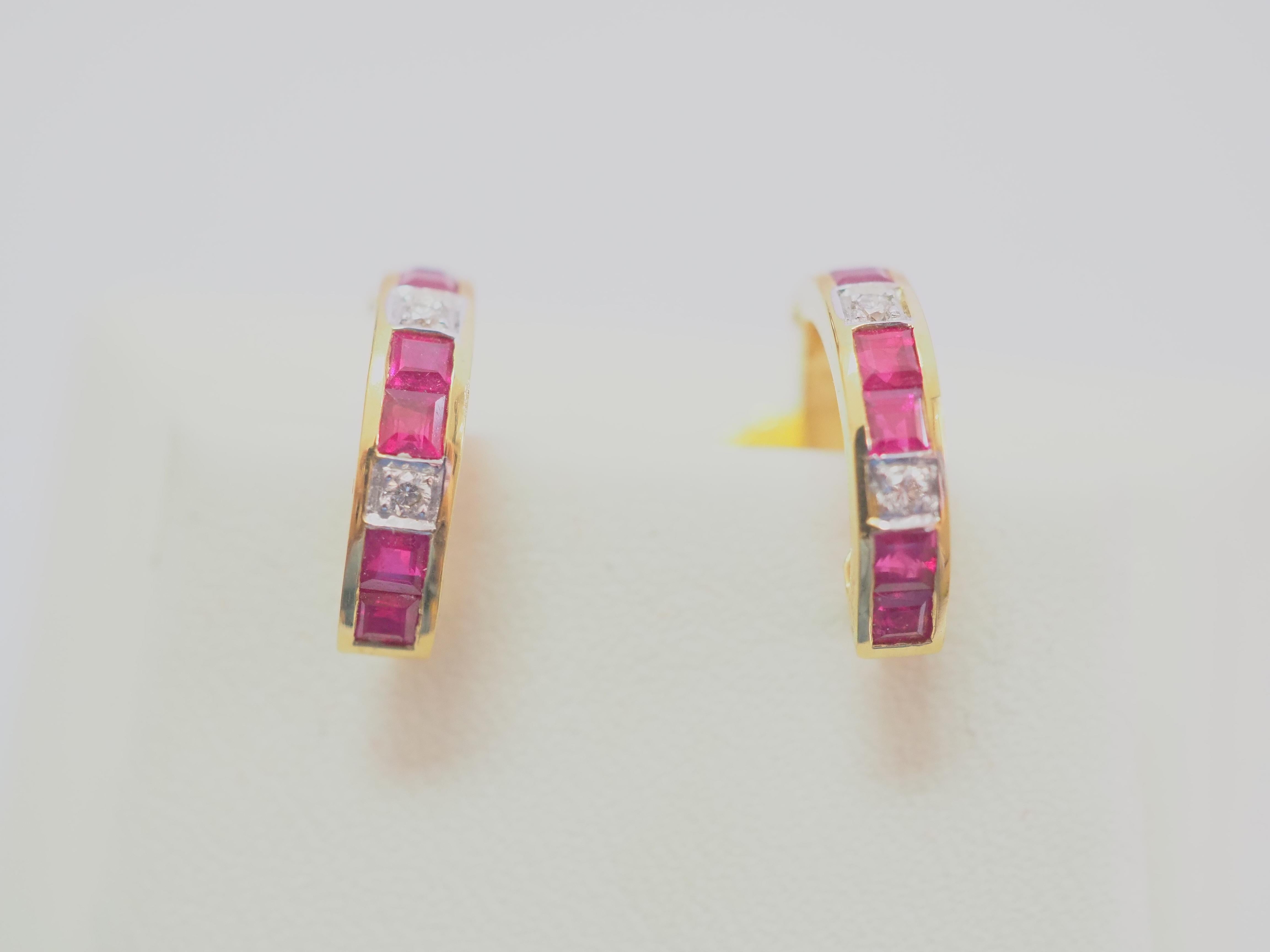 Beautiful and unique earrings made in the early 2000s and has never been worn. The earrings have the unique shape of a hoop omega and is intricately designed. There are 12 squared bright red rubies in total and therefore 6 for each ear.  4 brilliant