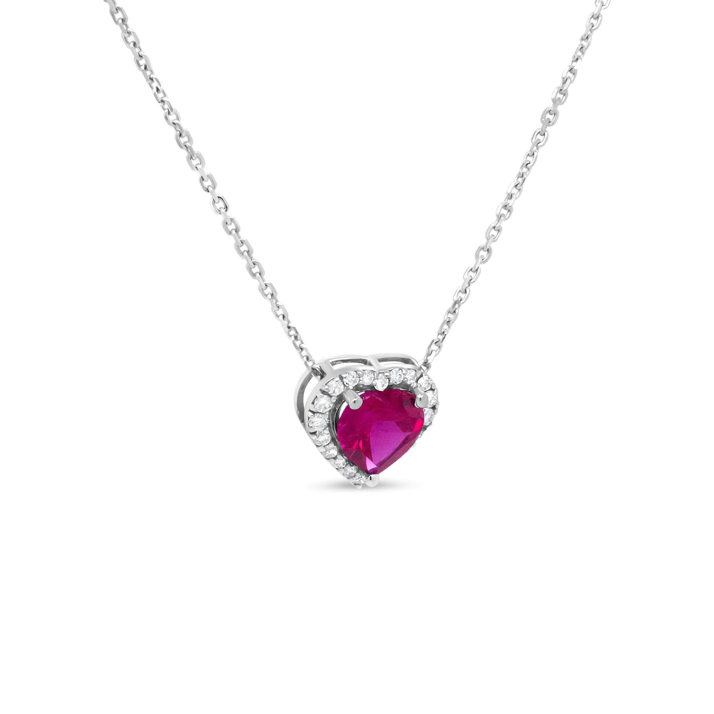 A sweet little pendant with mega sparkle, this elegant 18k white gold pendant necklace is meticulously crafted with romantic flair. A 6.7 x 7mm heart-shaped, glass-filled ruby in a color-treated red hue centers this pendant in a 3-prong setting.