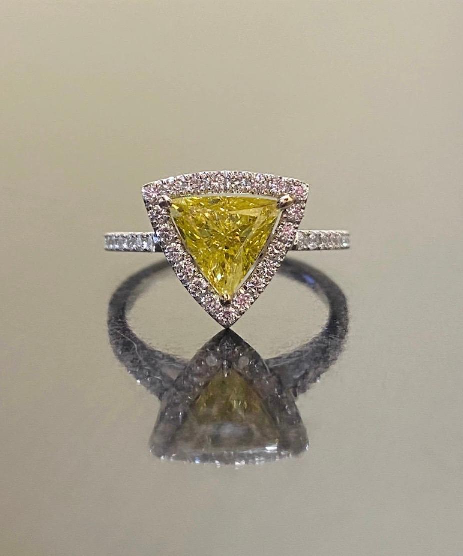 DeKara Design Collection

Metal- 18K White Gold, 18K Yellow Gold, .750.

Stones- EGL Certified Color Enhanced Triangle Center Fancy Intense Yellow Color Treated, SI2 Clarity 1.05 Carats. 84 Round Diamonds G Color VS2 Clarity 0.45 Carats.

Entirely