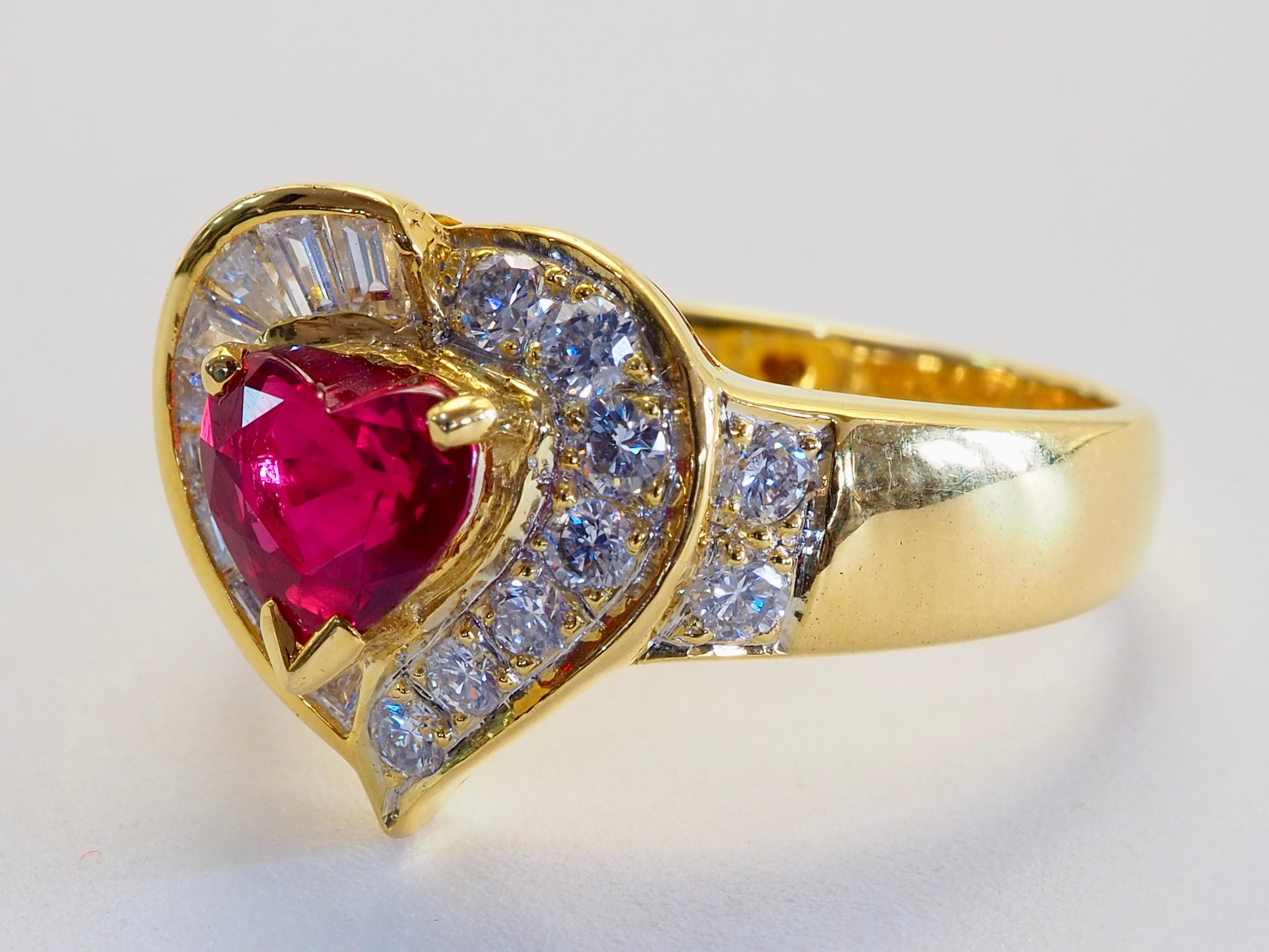 Top color ruby with romantic heart shape to make you want to call the dibs!
The glorious ruby is surrounded by tapered baguette and brilliant diamonds split on either side making 2 sides of heart. Very elaborate heart motif work filled with romance