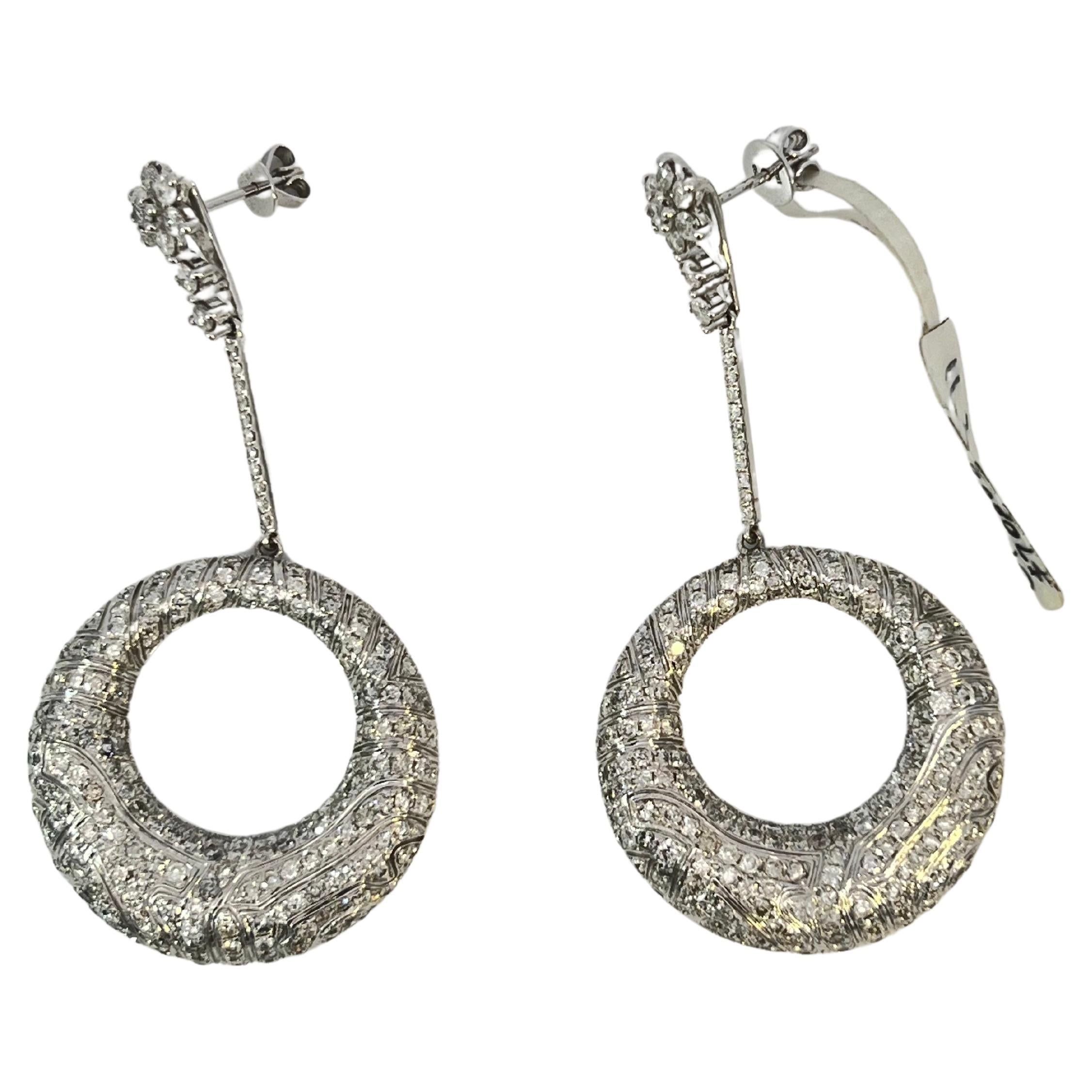 This amazing star moon-light dangle chandelier earring is a true masterpiece that exudes glamour and luxury. The earrings feature over 600 natural diamonds that weigh an impressive 11.45 carats. The diamonds are of the highest quality, with a