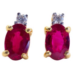 18k Gold 1.20ct Myanmar Red Oval Ruby 
0.05ct Diamond Stud Earrings