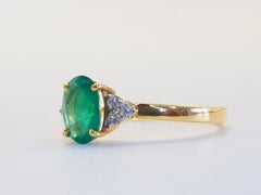 Anello di fidanzamento in oro 18 carati con smeraldo ovale da 1,20 carati e diamante brillante da 0,12 carati