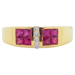 Bague en or 18 carats sertie en rail d'un rubis carré de 1,20 ct et d'un diamant de 0,06 ct