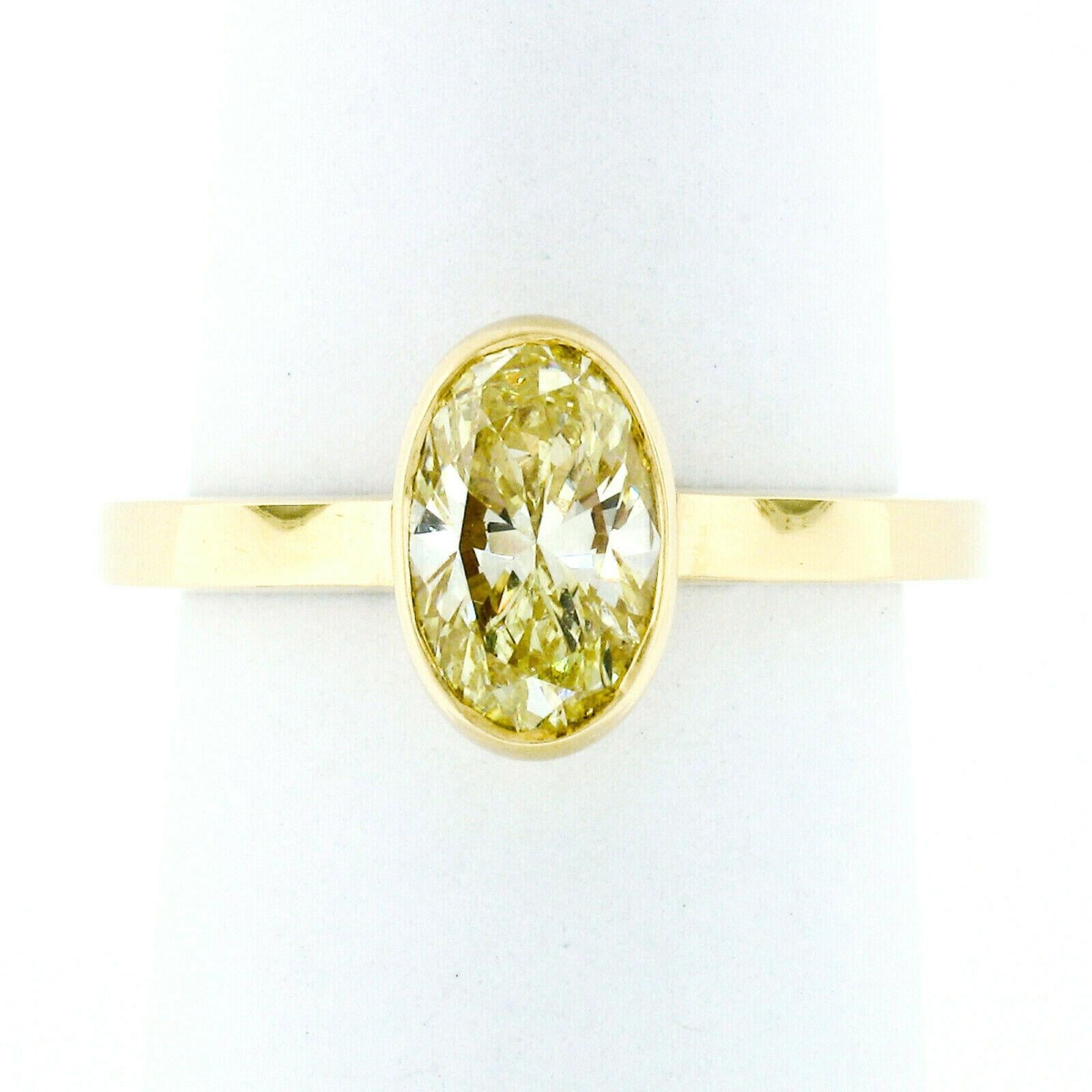 18k Gold 1.32ct Bezel GIA Fancy Yellow Oval Diamond Solitaire Engagement Ring In New Condition In Montclair, NJ