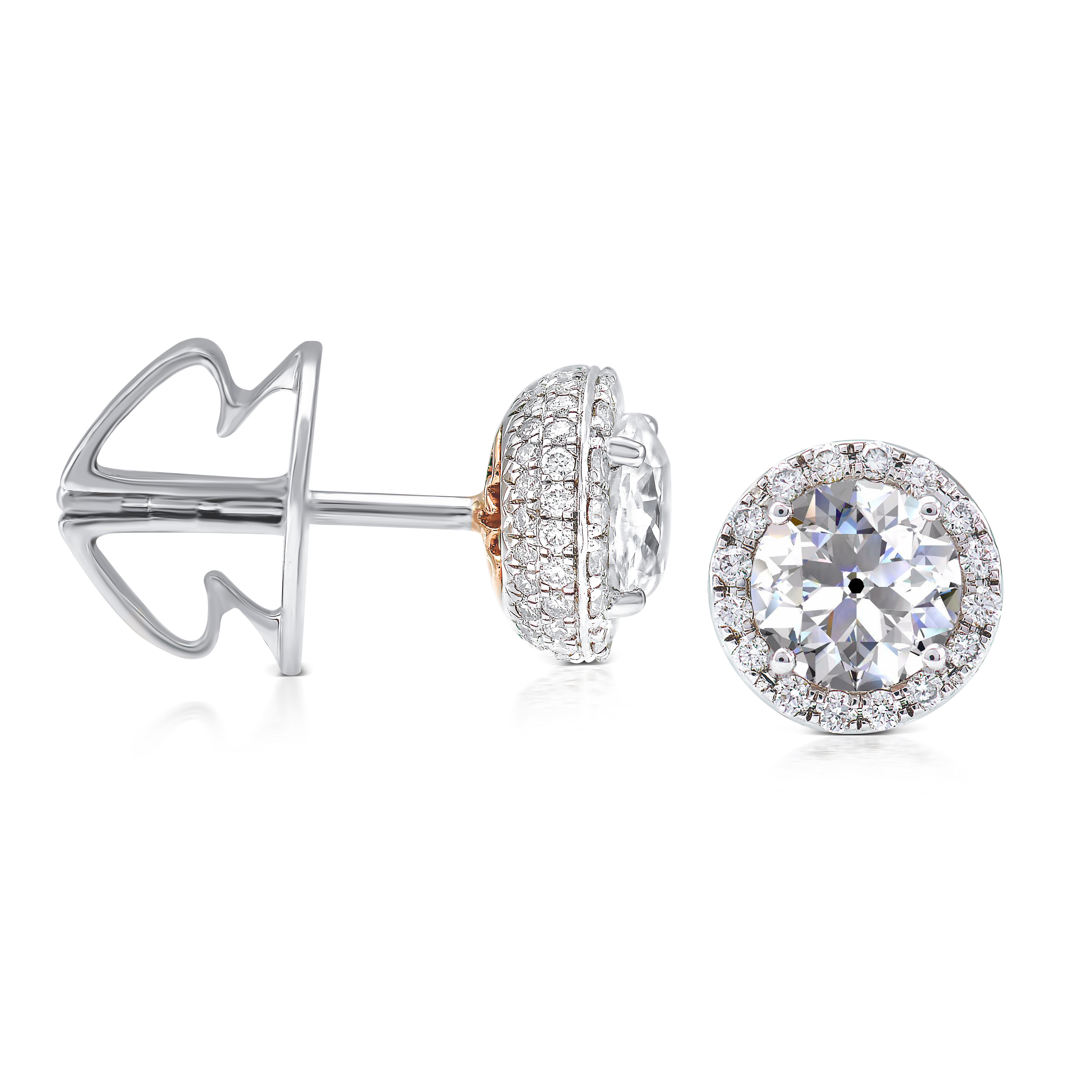 These exquisite Rarever earrings feature a stunning combination of old cut diamonds and white gold. Each earring showcases a 0.50ct old European brilliant cut diamond with F color and VS clarity, delicately surrounded by a halo of over a hundred