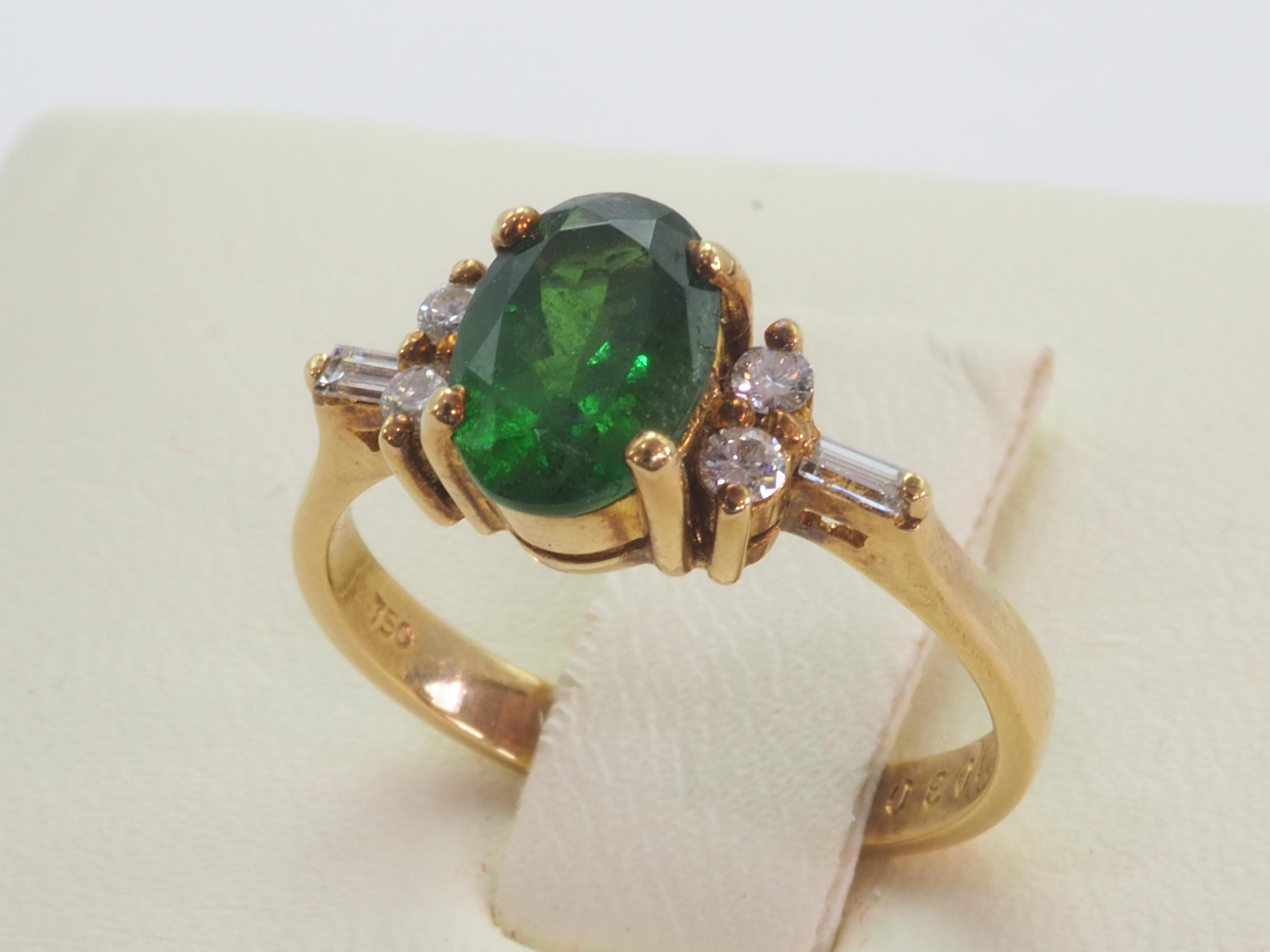 Women's 18K Gold 1.40ct Vivid Oval Tsavorite & 0.15ct Diamond Engagement Ring For Sale