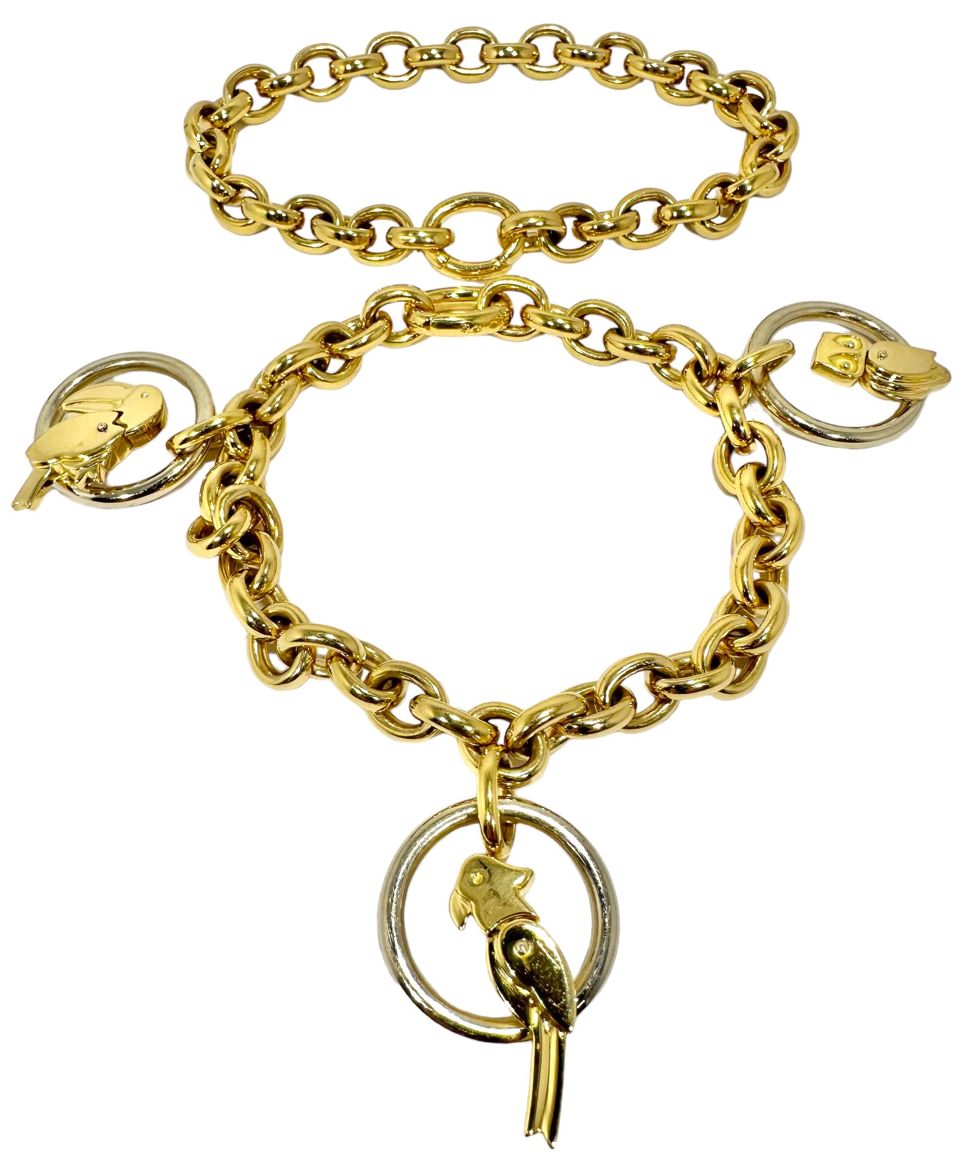 This very unusual 18k yellow gold necklace by designer Pomellato, features three separate bird pendants; a Toucan, a Parrot and an Owl, each perched in a ring of 18k white gold. This lovely jewel can be worn as a 15 inch choker length necklace, or