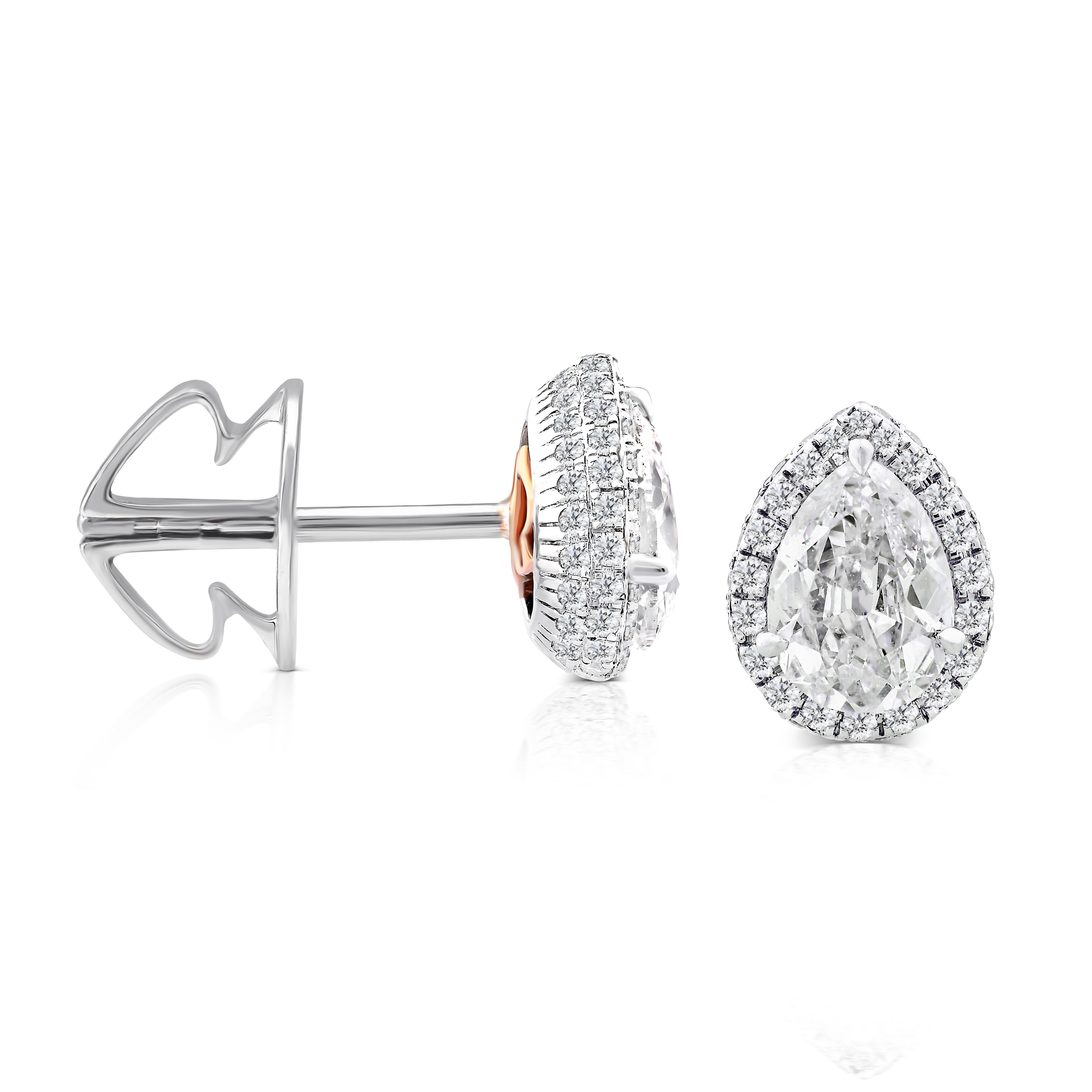 These exquisite Rarever earrings feature a stunning combination of old cut Pear solitaire diamonds and white gold. Each earring showcases a 0.60ct old European brilliant cut diamond with F color and VS clarity, delicately surrounded by a halo of