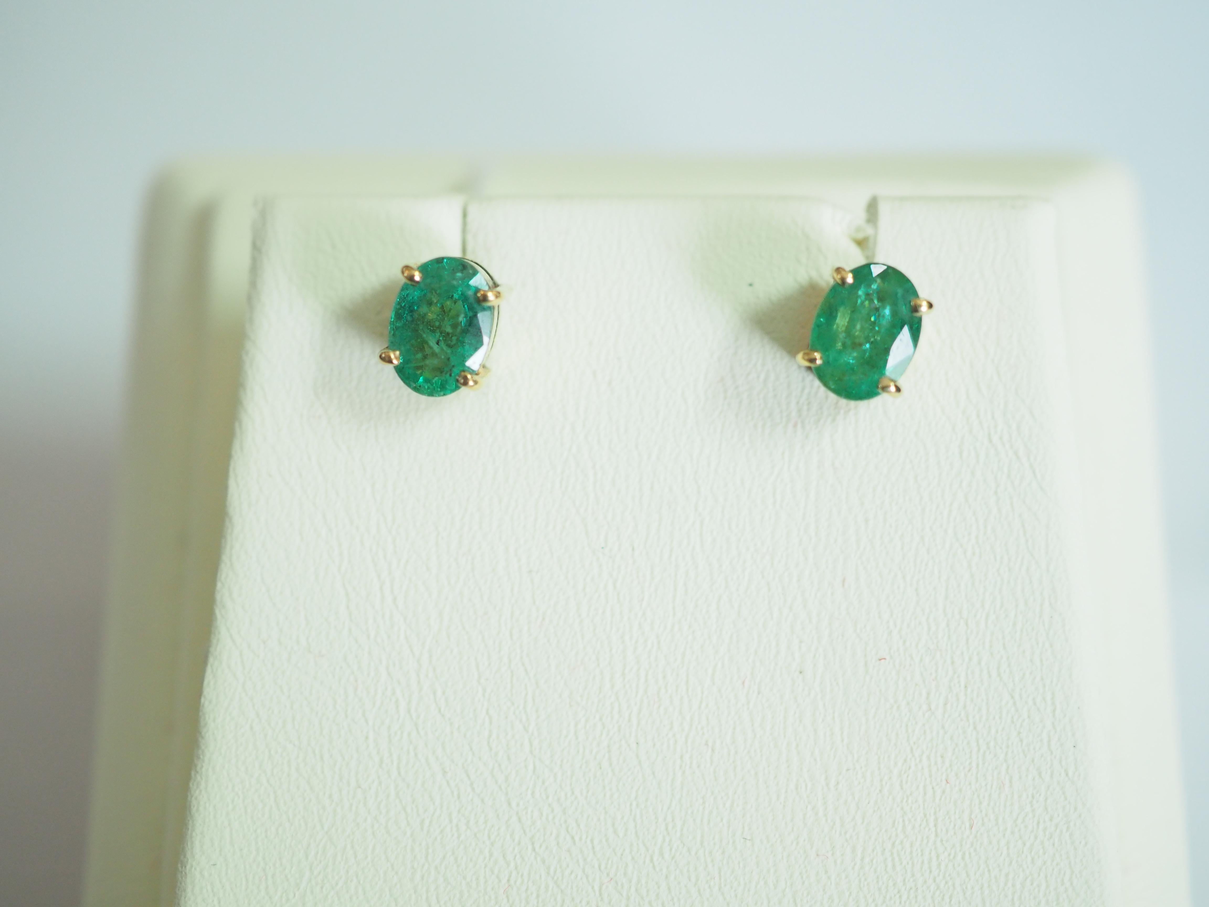 Presented is a gorgeous stud emerald earring. The lovely oval Zambian emeralds are natural and moderately clear with natural inclusions, but the color is good which is rich in green saturation. The earring is a classic push back stud and all the