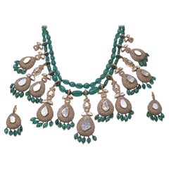 18k gold 16.70cts Polki & 41.64cts rose cut Diamond & 318.99cts Emerald Necklace