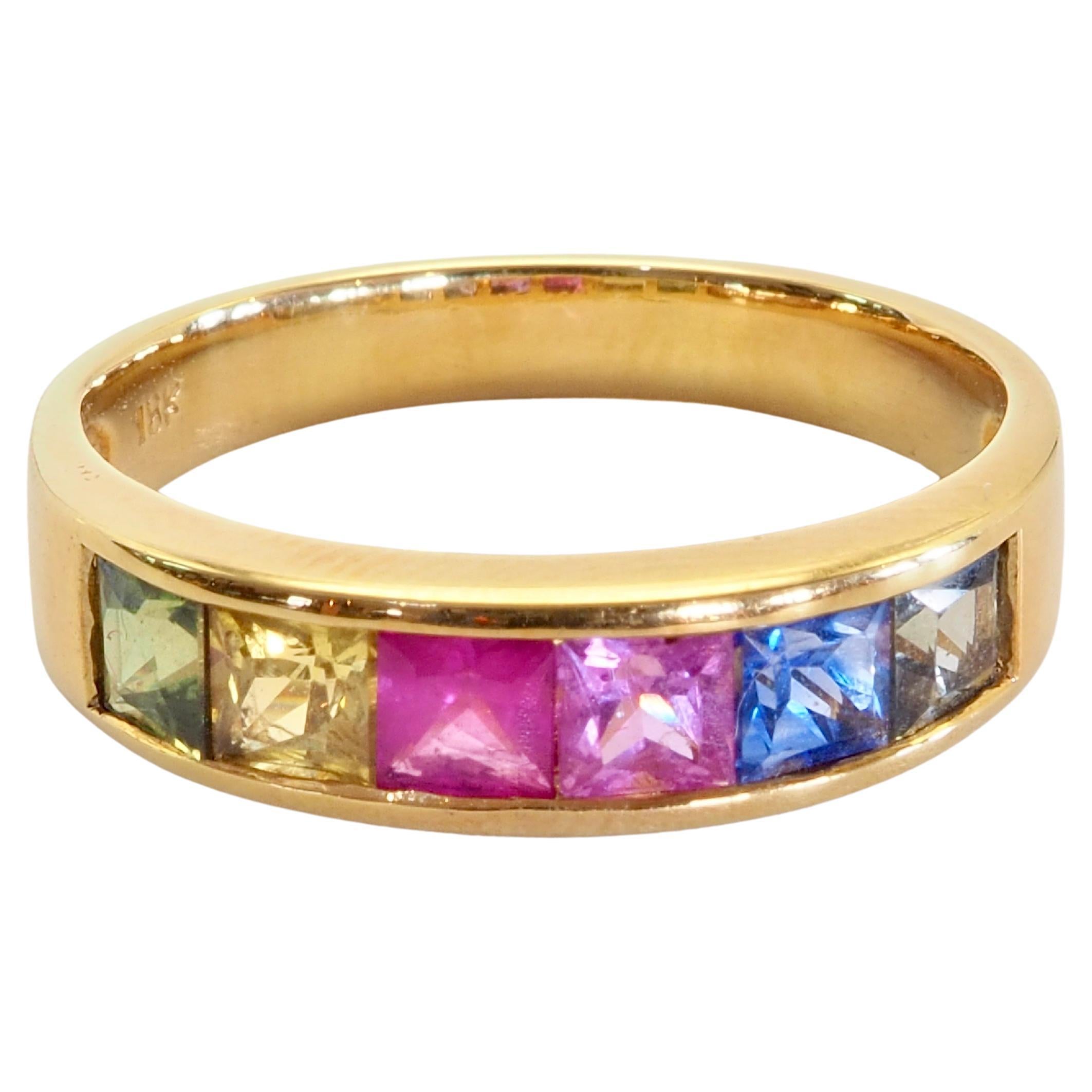 Multi color sapphires or rainbow sapphire band ring with decent squared cut size stones and wide band for maximum exposure and statement. 

Product Details:

Metal: 18k Solid Gold
Metal Color: Yellow Gold
Multi color sapphires: Natural, square cut,
