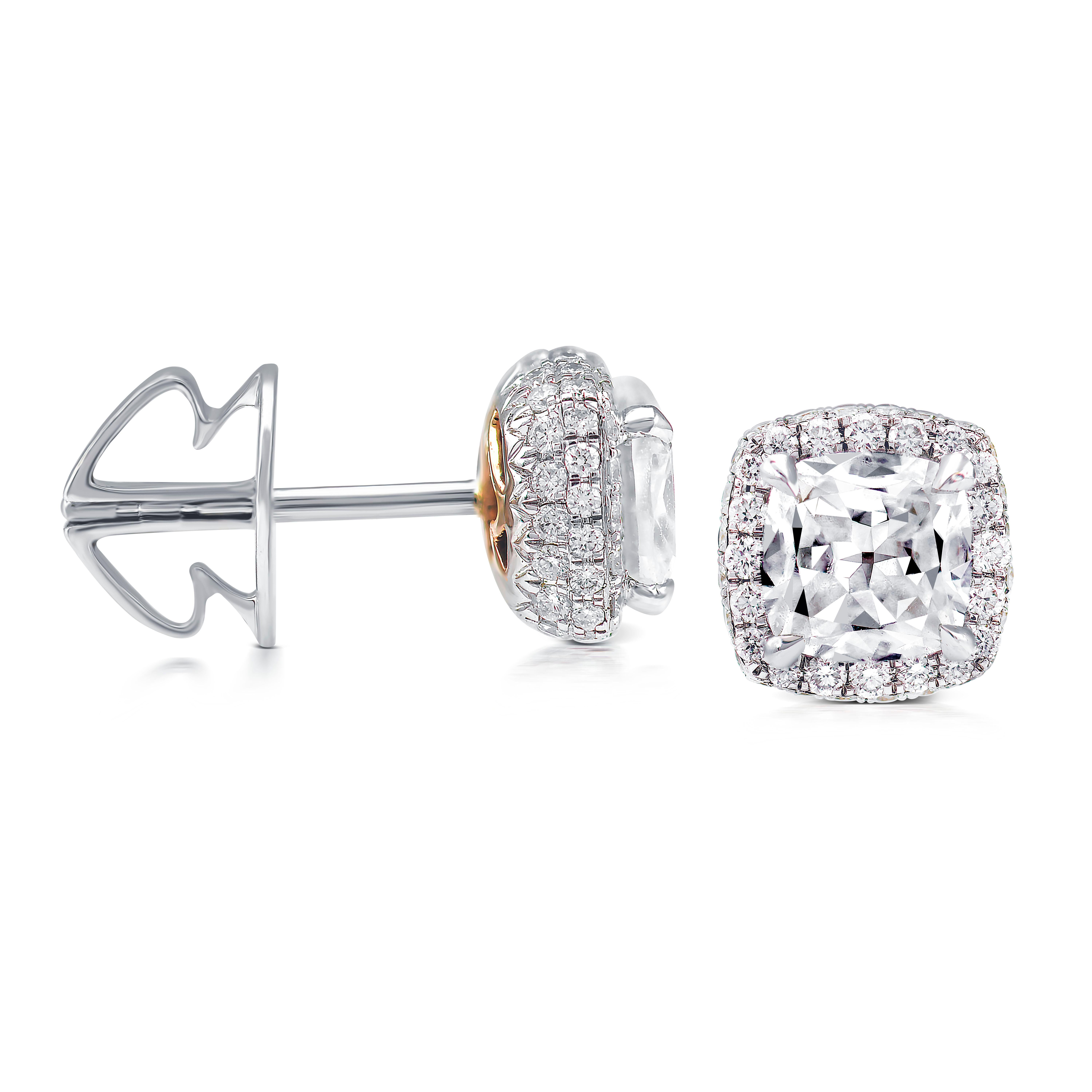 These exquisite Rarever earrings feature a stunning combination of old cut cushiion diamonds and white gold. Each earring showcases a 0.65ct old European brilliant cut diamond with F color and VS clarity, delicately surrounded by a halo of over a