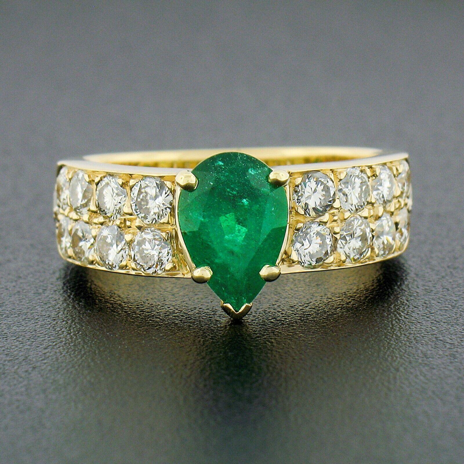 This stunning ring was crafted from solid 18k yellow gold and features a gorgeous pear cut emerald solitaire neatly prong set at its center. This stone stands out with its attractive size and deep, vibrant, green color that gives this ring such an