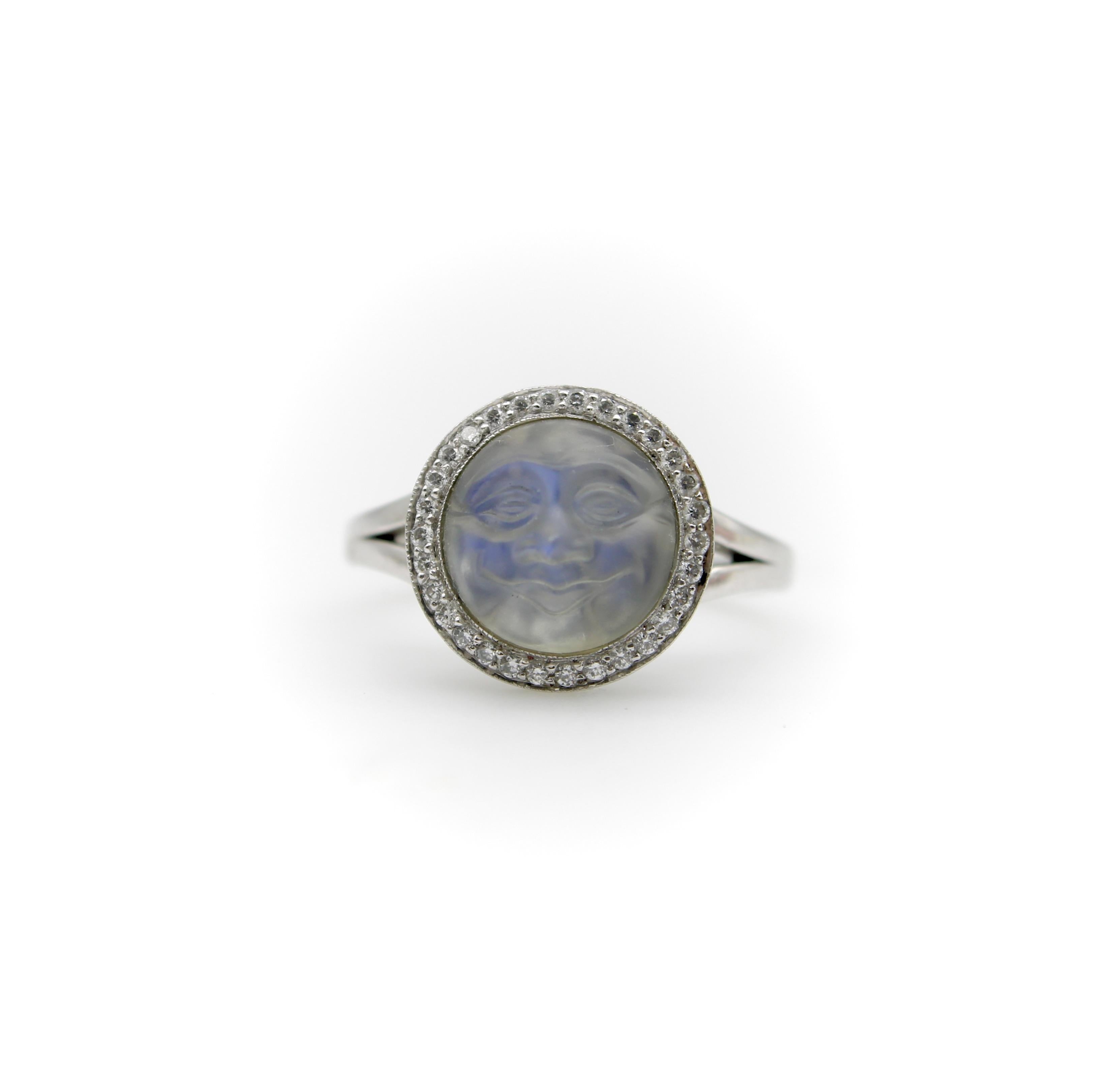This extremely well-detailed moonstone has a charming face of the man in the moon. It is exquisitely carved, with a matte surface to the carving. The man has a nice wide smile and rounded cheeks—he also reminds us of the face of Buddha. The carving