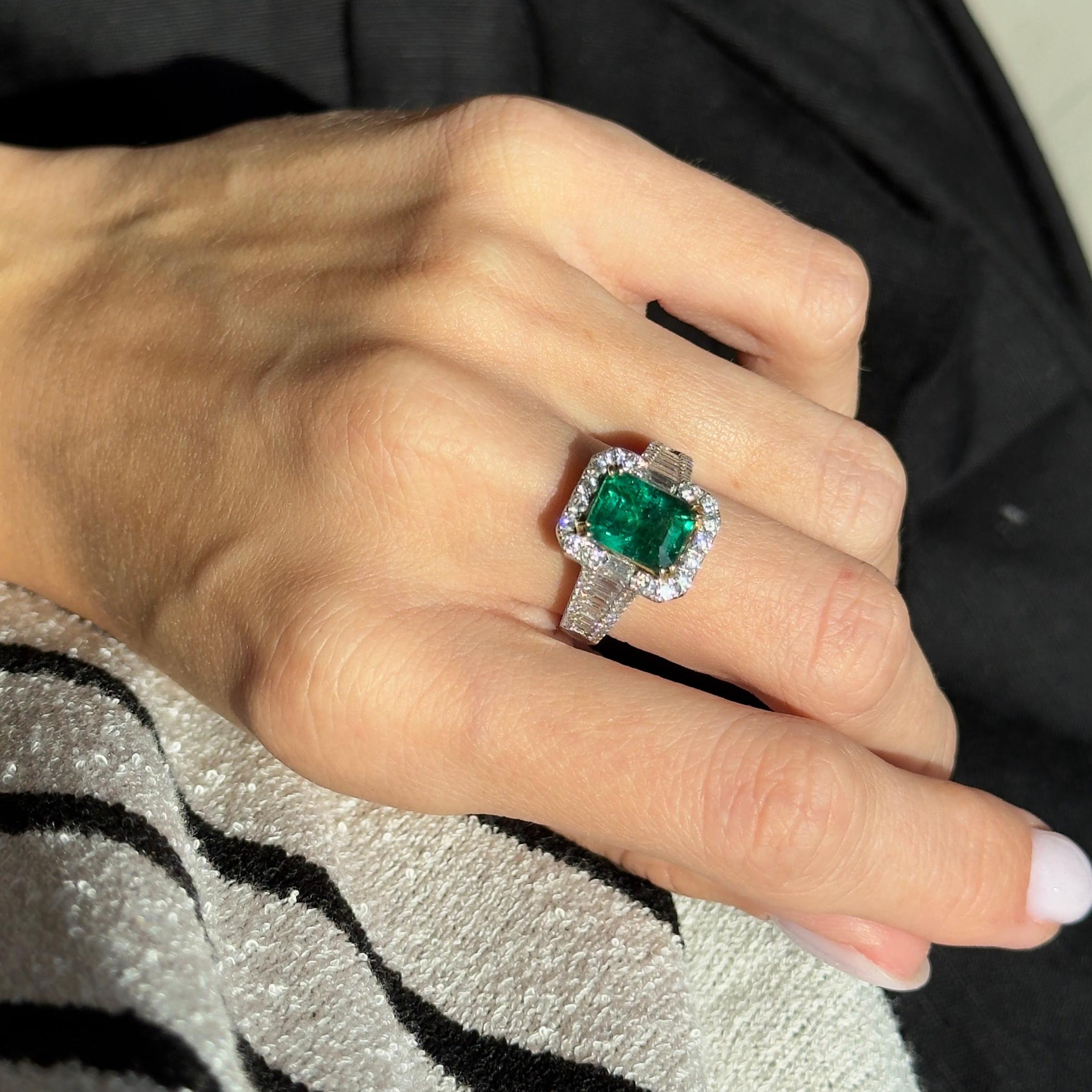 Era: New
Composition: 18K White & Yellow Gold
Primary Stone: Emerald Cut Natural Emerald
Carat Weight: 2 Carats
Accent Stone: Twenty Baguette & Sixty Round Brilliant Diamonds
Carat Weight: 1.5 Carats in Total
Color/Clarity: H-I / SI1-2
Ring Size: