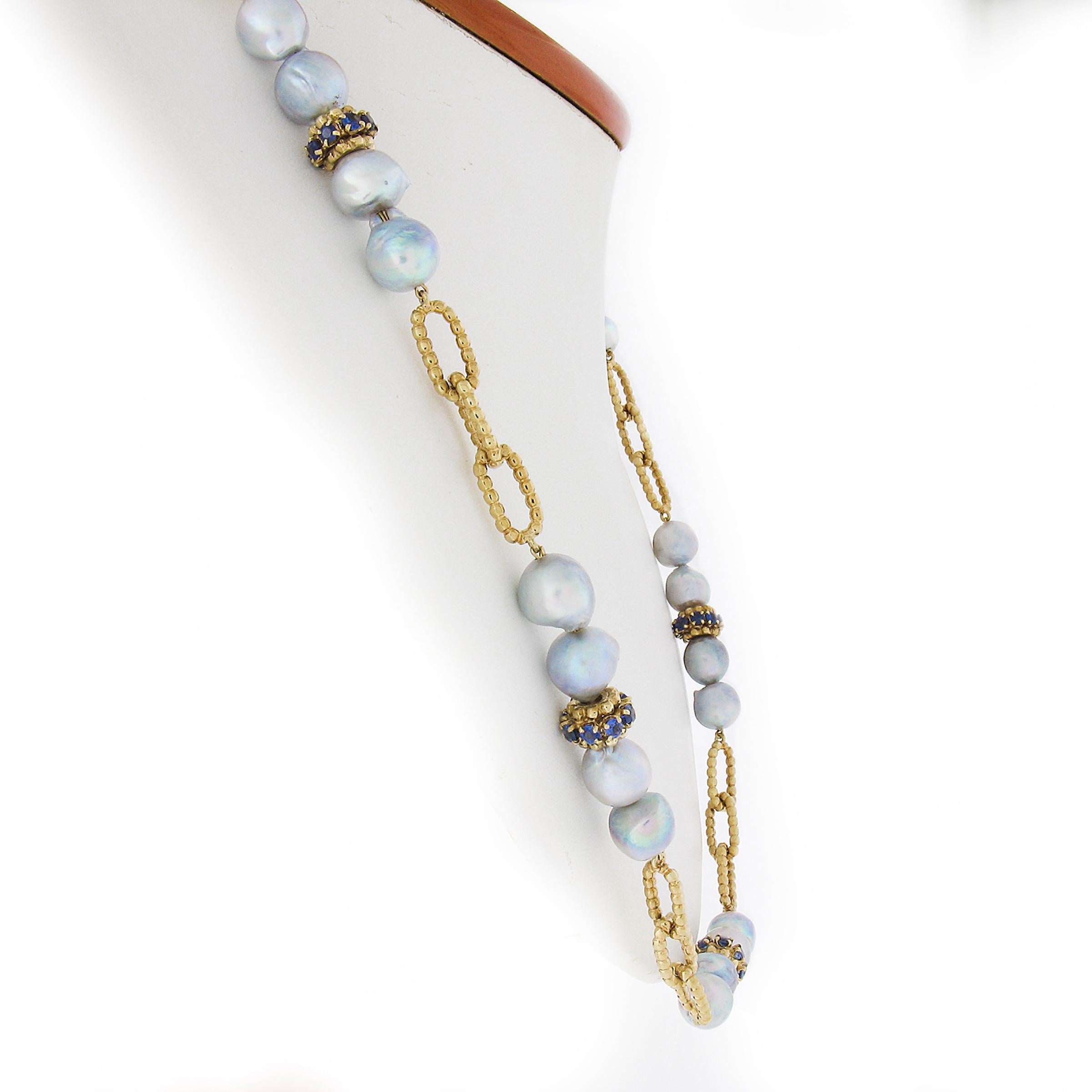 --Stone(s):--
(28) Natural Cultured Pearls - Baroque Shape - Wire Strung - Silvery Gray Color w/ Green overtone- 8-10.1mm (approx.)
(56) Natural Genuine Sapphires - Round Brilliant Cut - Prong Set - Blue Color - 5-6ctw (approx.)
Total Carat