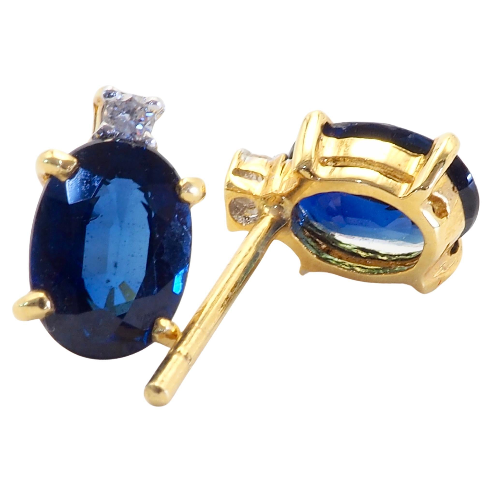 Presented here is a very fine and gorgeous oval blue sapphire and diamond stud earring. The oval sapphire twin has very nice medium- dark blue tone and saturation with a lot of clarity and brilliance. The brilliant round diamonds are genuine with