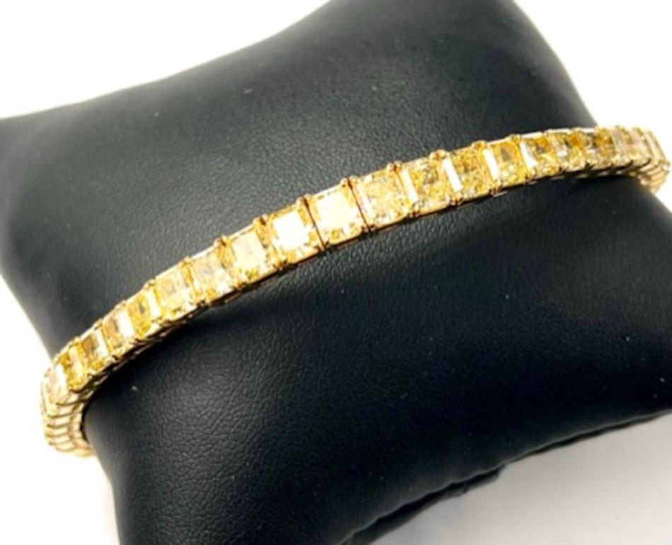 This is a gorgeous bracelet that fits the wrist effortlessly.  It is comprised of 42 Natural Yellow Radiant Cut Diamonds set in a handmade flexible bangle bracelet. The yellow hue of these diamonds matches beautifully and the saturation and depth of