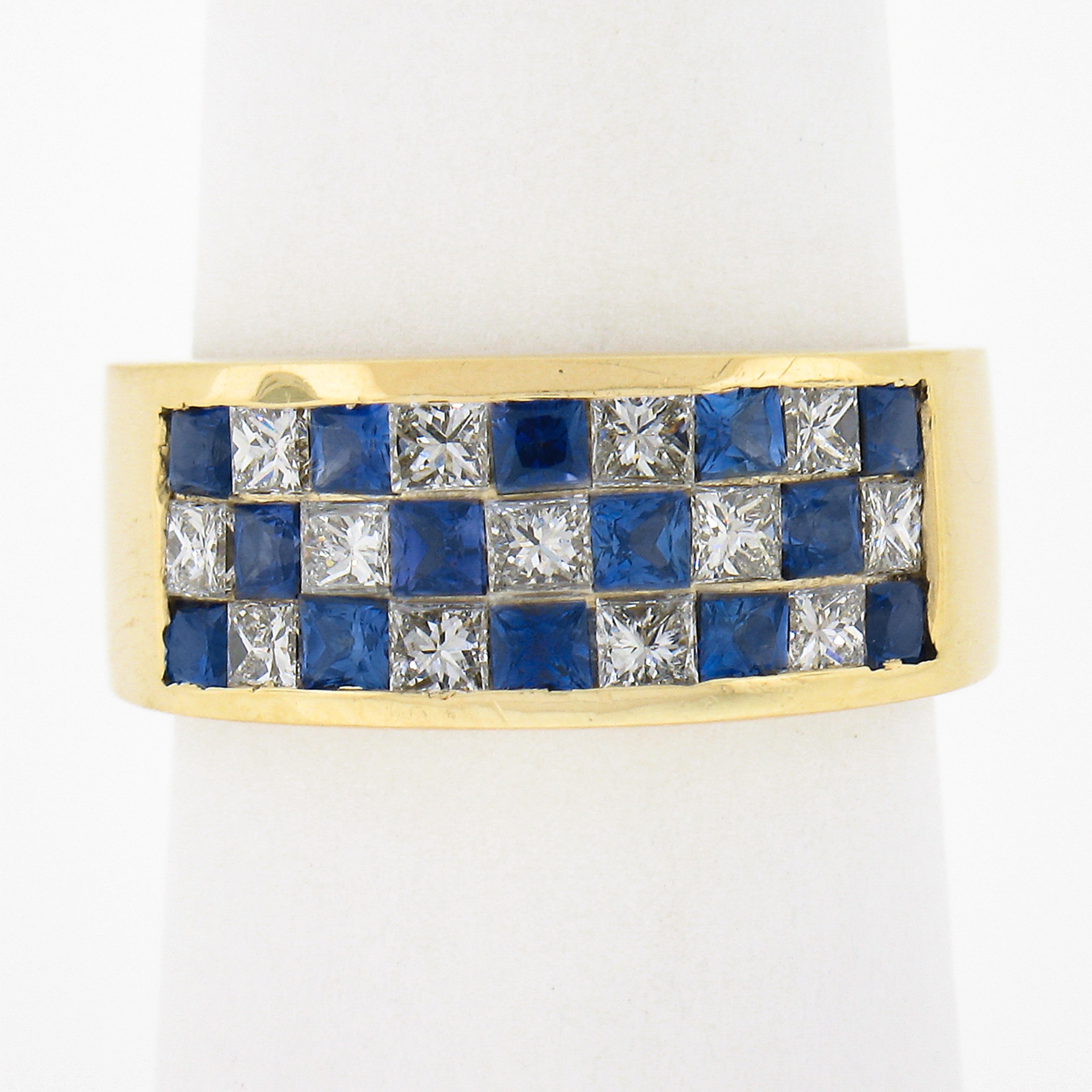 This beautiful wide ring is crafted in solid 18k yellow gold and features a like checkerboard style 3 rows of alternating very fine quality square cut sapphires and diamonds. The sapphires are well matched showing amazing blue color for a super rich