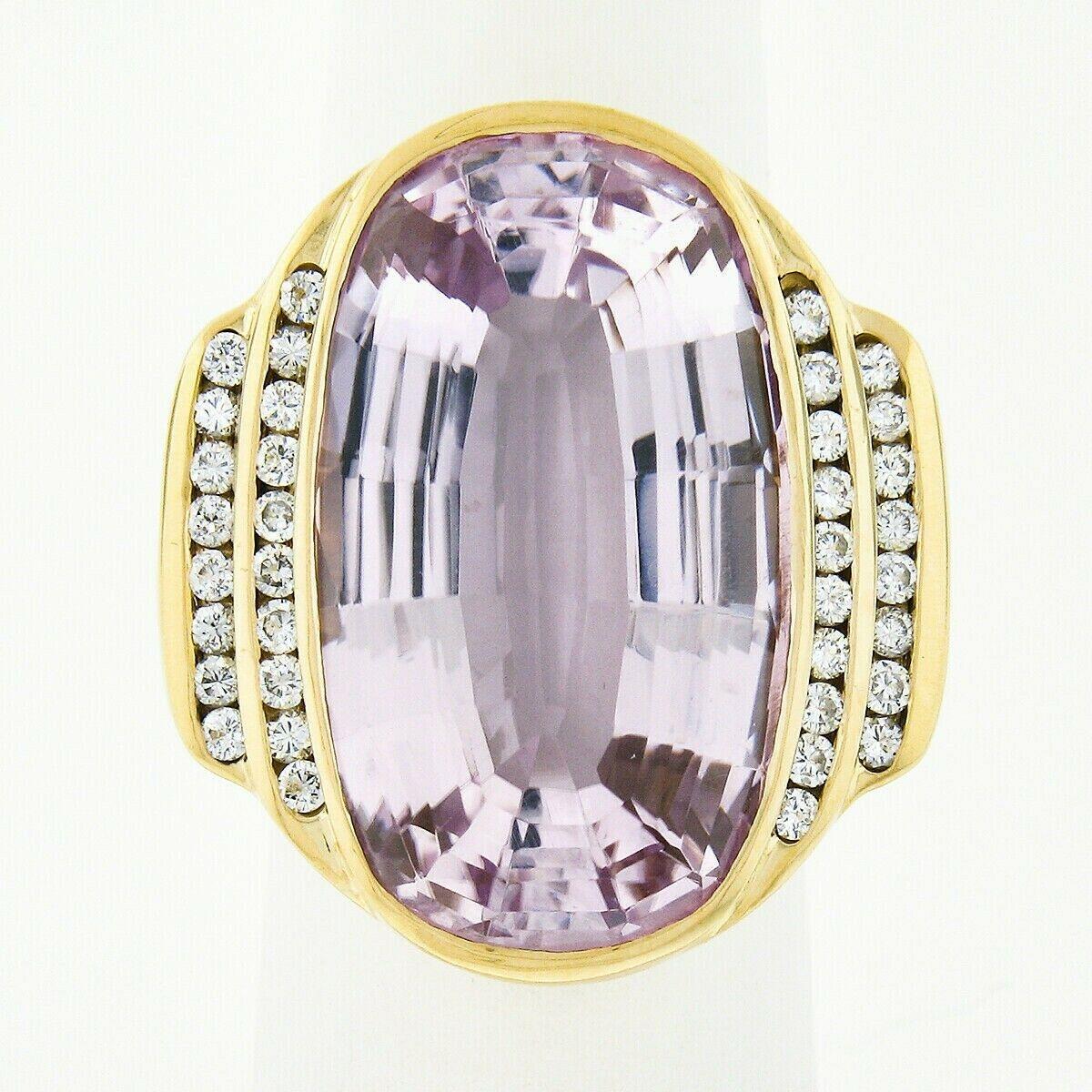 This breathtaking kunzite and diamond cocktail statement ring is crafted in solid 18k yellow gold and features an absolutely magnificent natural kunzite stone neatly bezel set at its center. This very large solitaire has a cushiony-oval step cut,