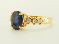 18K Gold 2.64ct Oval Deep Blue Sapphire & 0.20ct Brilliant Diamond Accent Ring