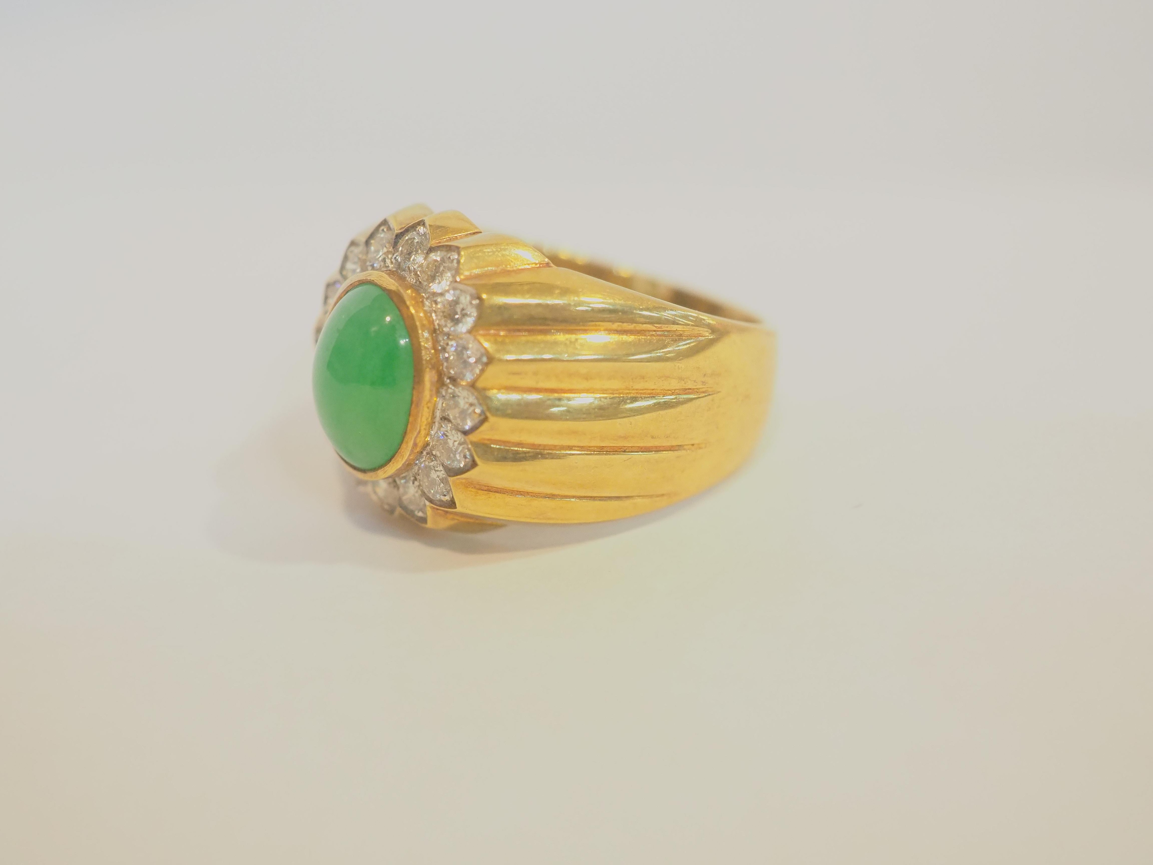  This fantastic cocktail piece is a beautiful 18K yellow gold fine Trombino dome ring for man. It features a fine cabochon Burma jadeite   as the main gemstone. The color is very saturated with nice glow, and the surface is very clear and is very
