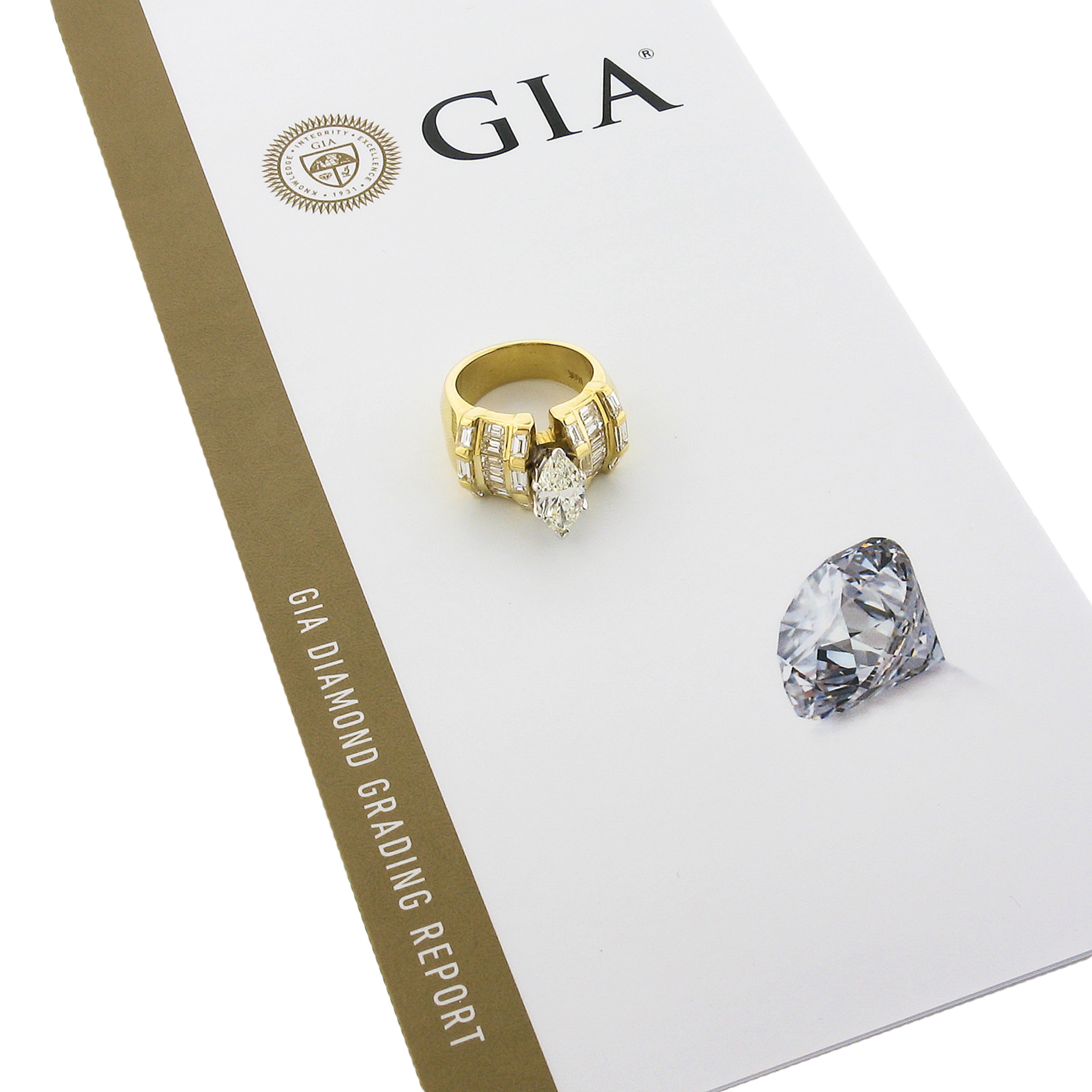 You are looking at a magnificent diamond engagement style ring that was very well crafted from solid 18k yellow gold. It features a truly breathtaking, GIA certified, marquise brilliant cut diamond solitaire neatly set with sturdy prongs at its