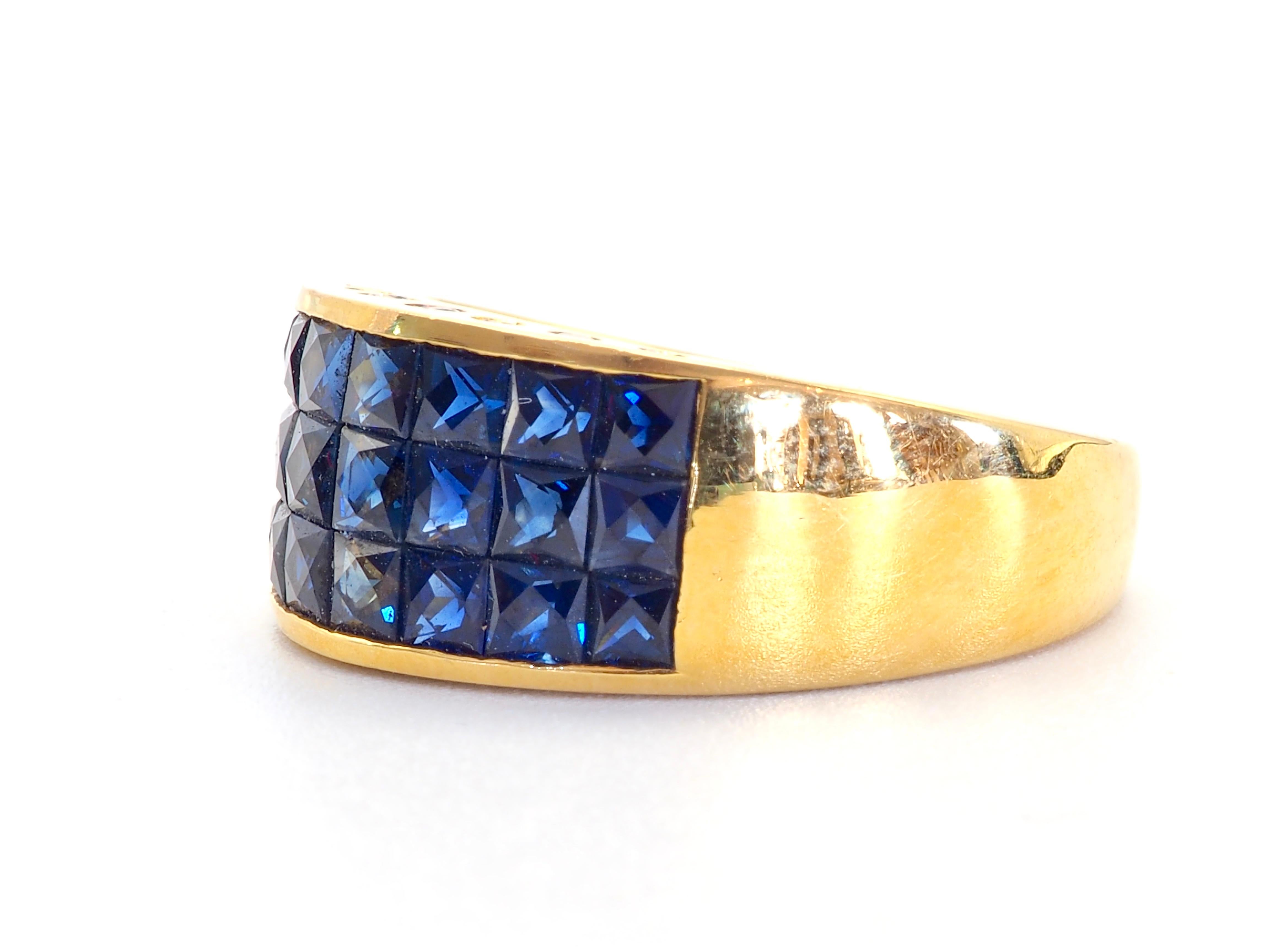 A gorgeous luxury Neo-vintage chunky invincible style band ring that is both suitable for all sexes. This ring has three rows of beautiful Ceylon sapphires and pave round diamonds channeled nicely into the band. The square cut sapphires have a