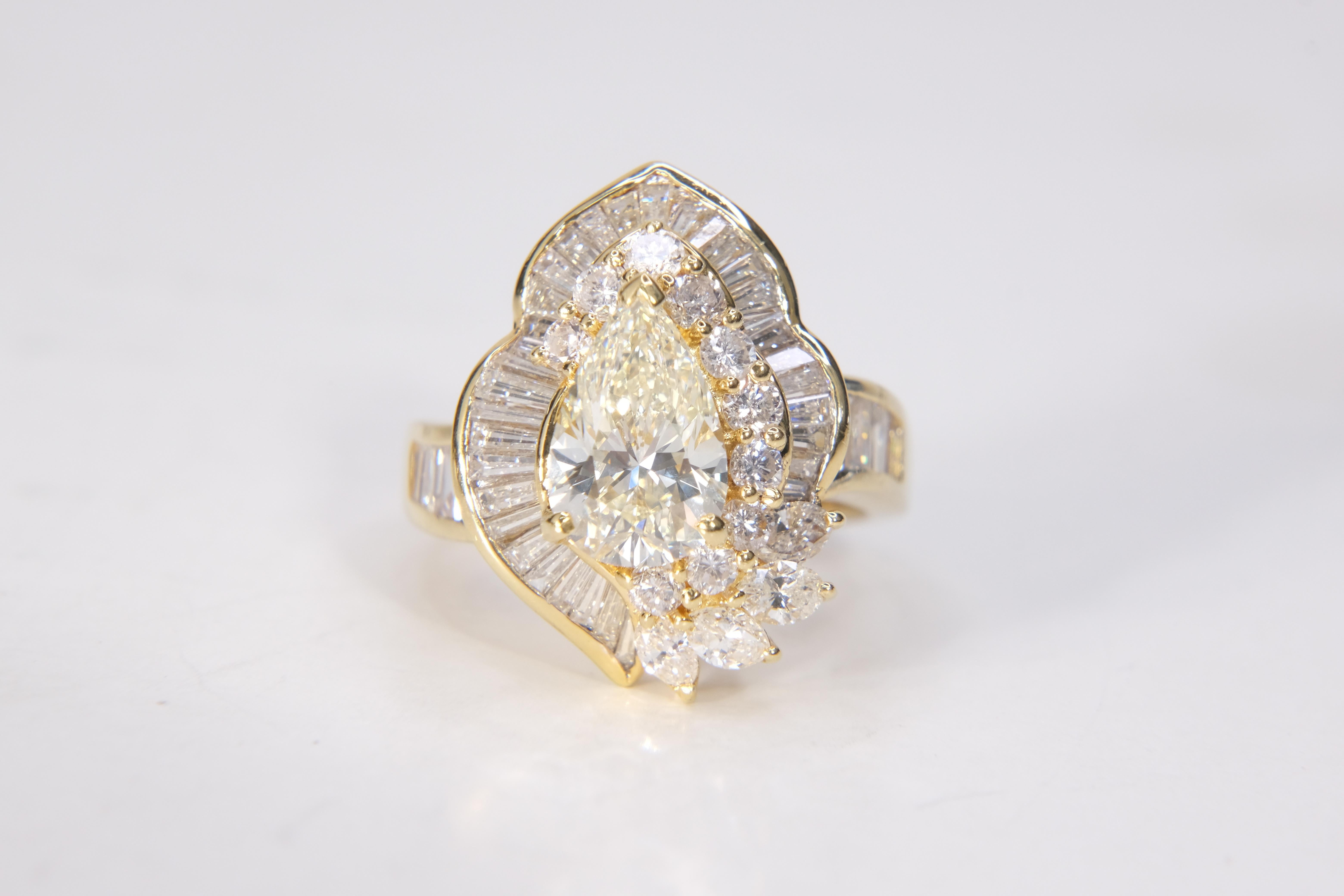 This ring has the distinction of having four different diamond cuts featured, all set in 18k gold. The main pear-shaped jewel is of wonderful proportions, not too long and not too fat, conditions which may afflict other pear-shaped cuts. The other