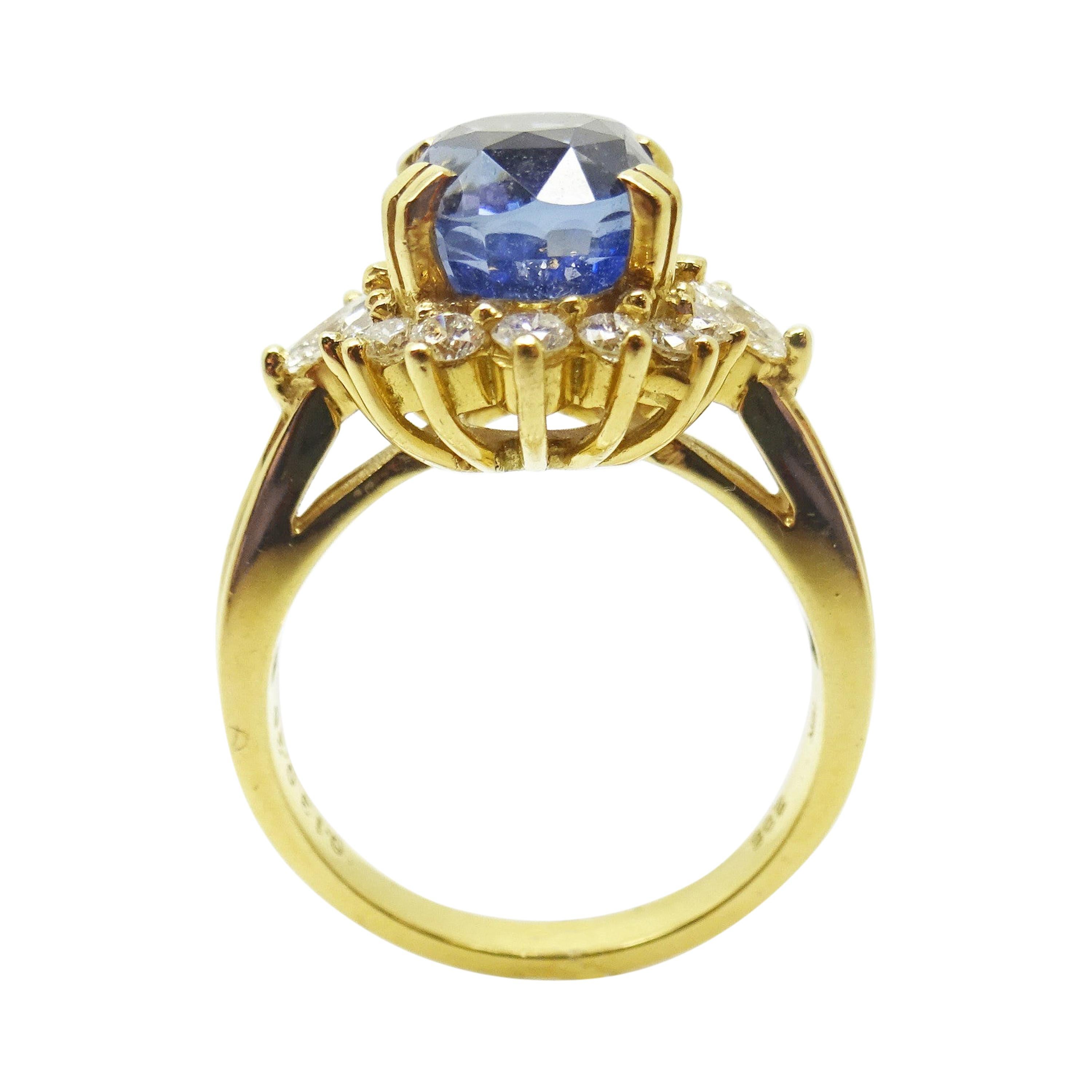 18k Gold 4.34cts Genuine Natural Ceylon Sapphire and Diamond Ring (#J3398)

18k yellow gold ceylon sapphire and diamond ring. This ring features a large oval ceylon blue sapphire weighing approximately 3.85 carats. The sapphire has fine